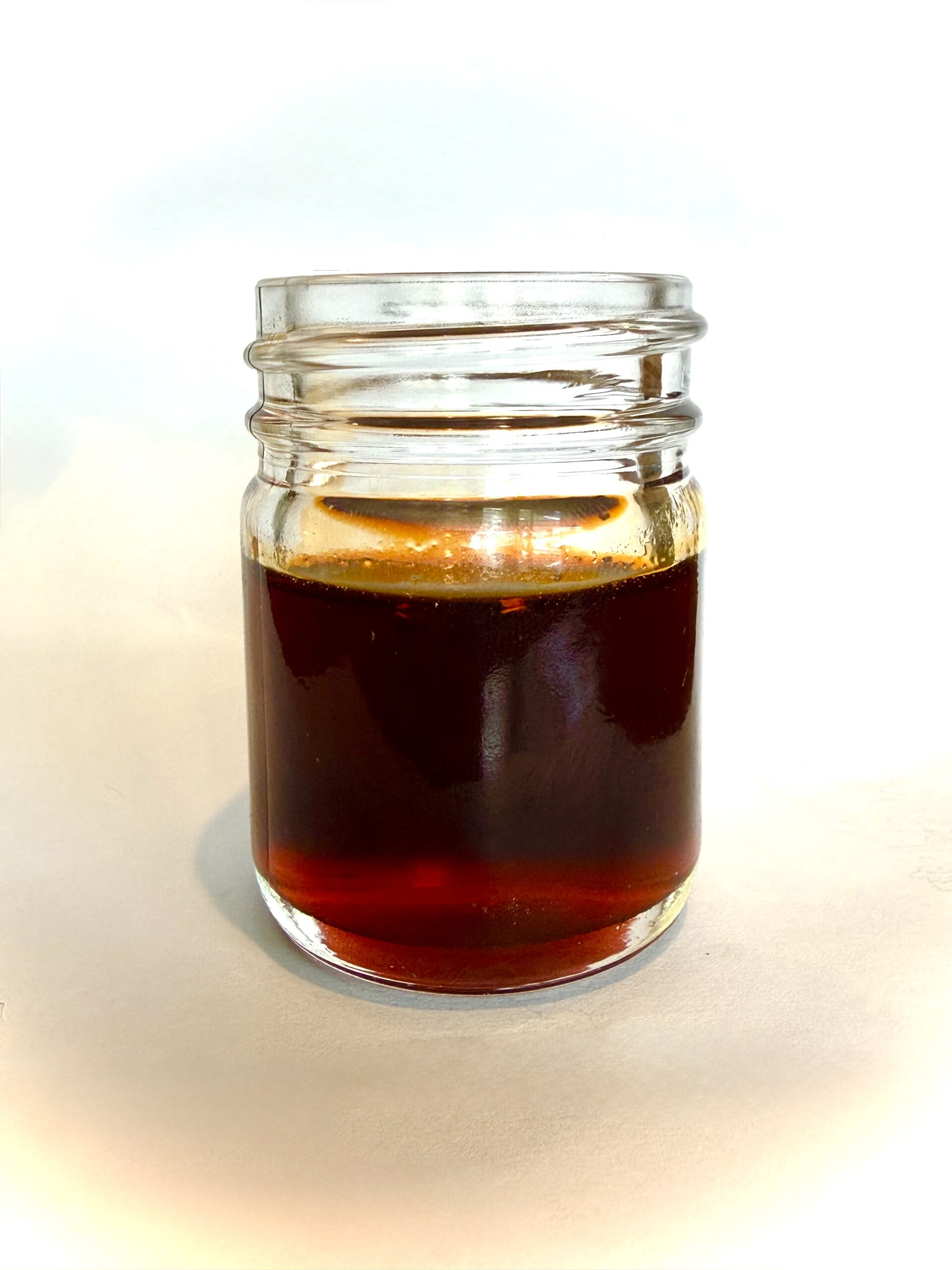 What is chili oil — a jar of deep red glossy infused chili oil — Flavor Index Lab