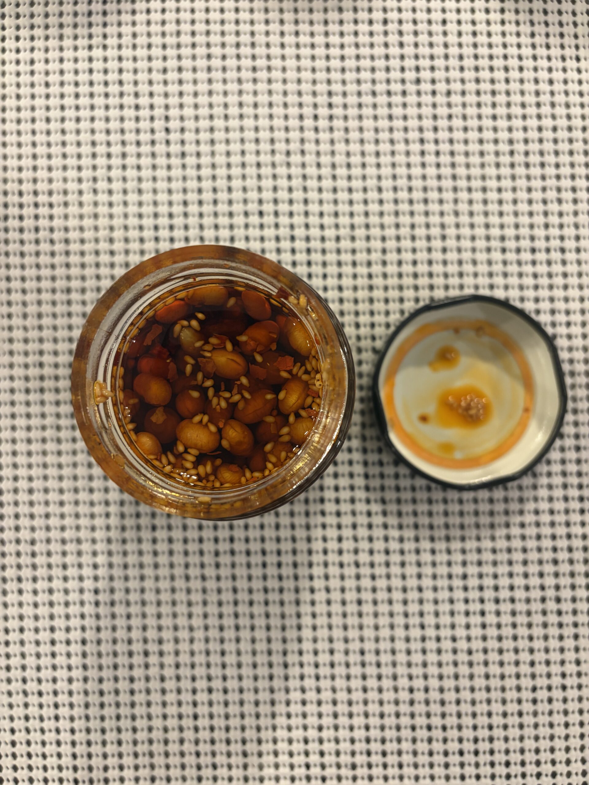Fly By Jing Xtra Crunchy chili crisp open jar top-down view — Flavor Index Lab