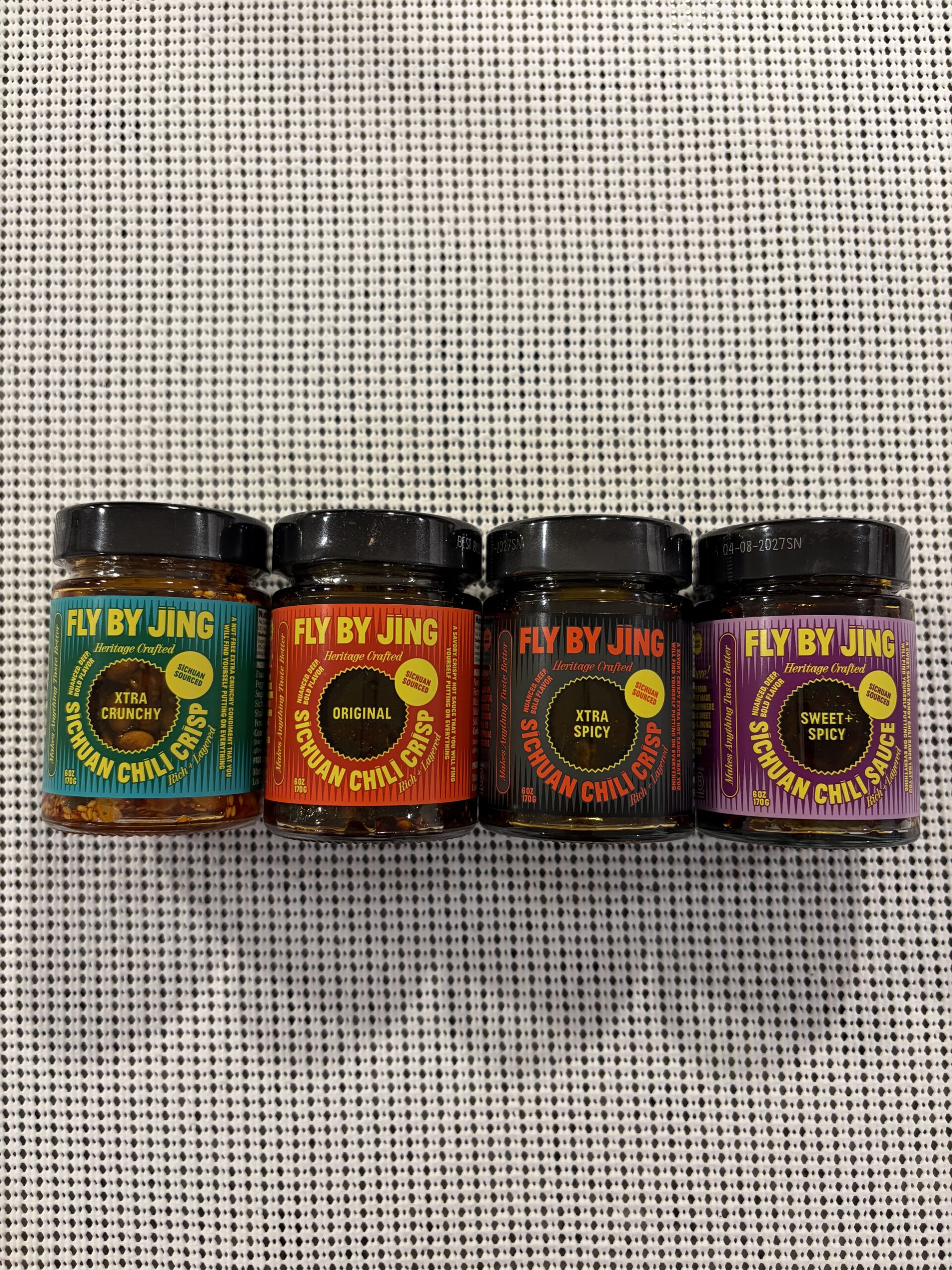 All four Fly By Jing chili crisp varieties lined up together — Flavor Index Lab