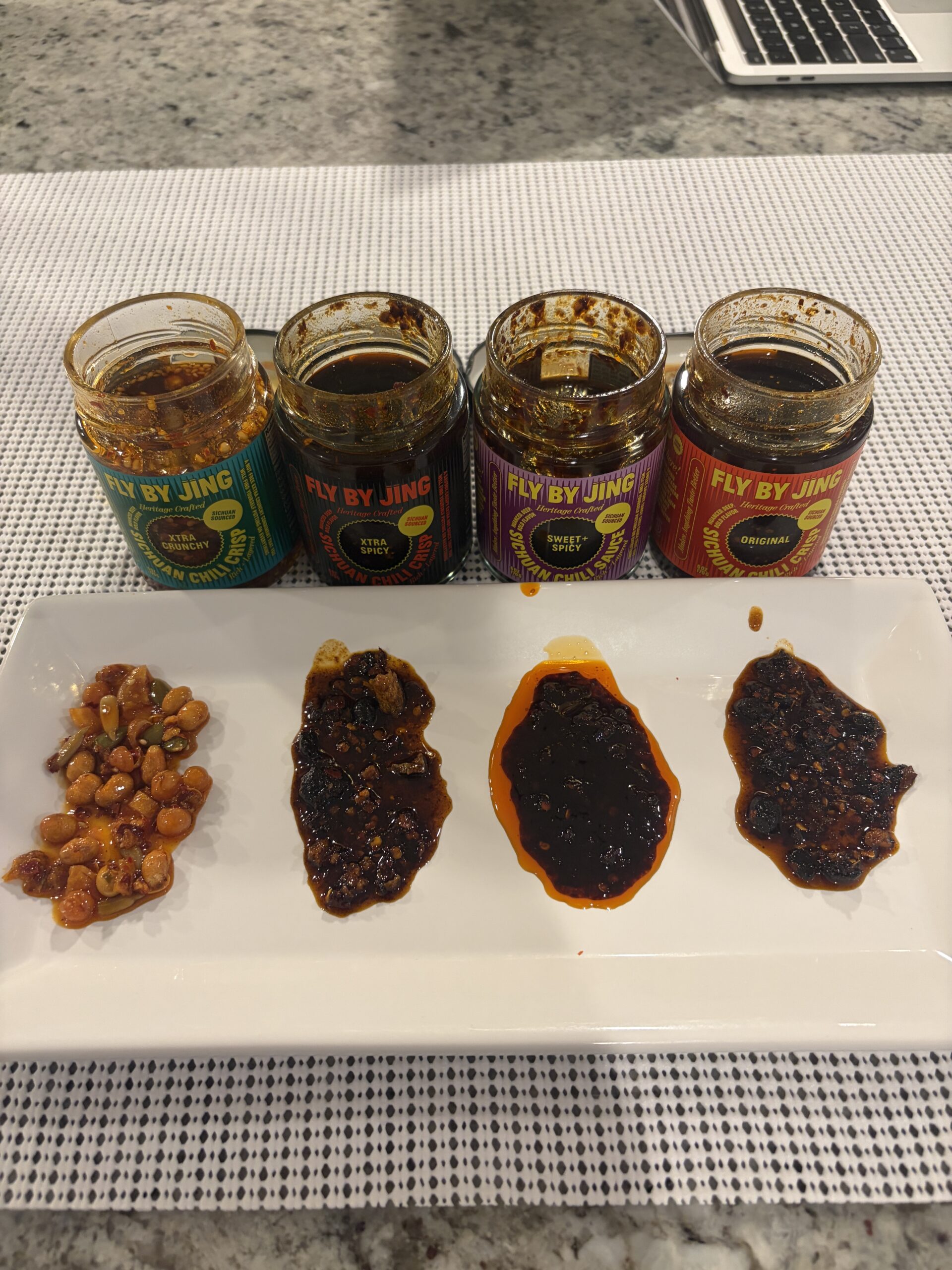 Fly By Jing Original, Extra Spicy, Extra Crunchy, and Sweet and Spicy side by side — Flavor Index Lab