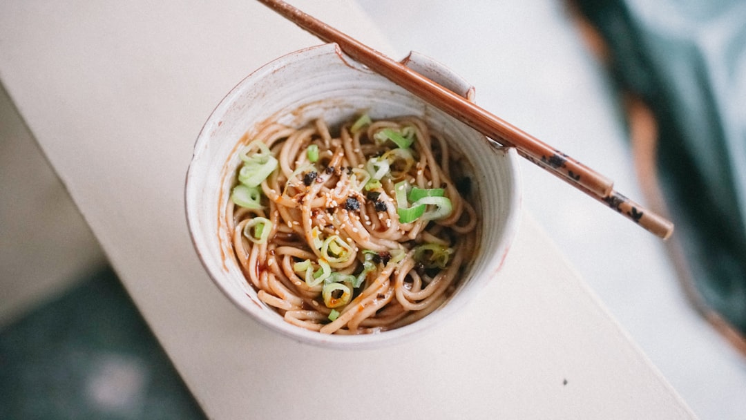 Noodle bowl finished with chili oil drizzle — Flavor Index Lab