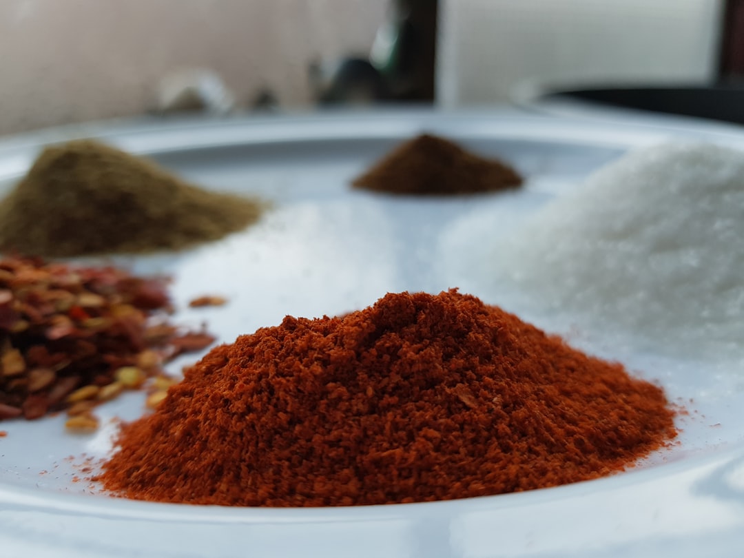 Assorted spices and seasonings used in chili crisp production including star anise and dried chilies — Flavor Index Lab