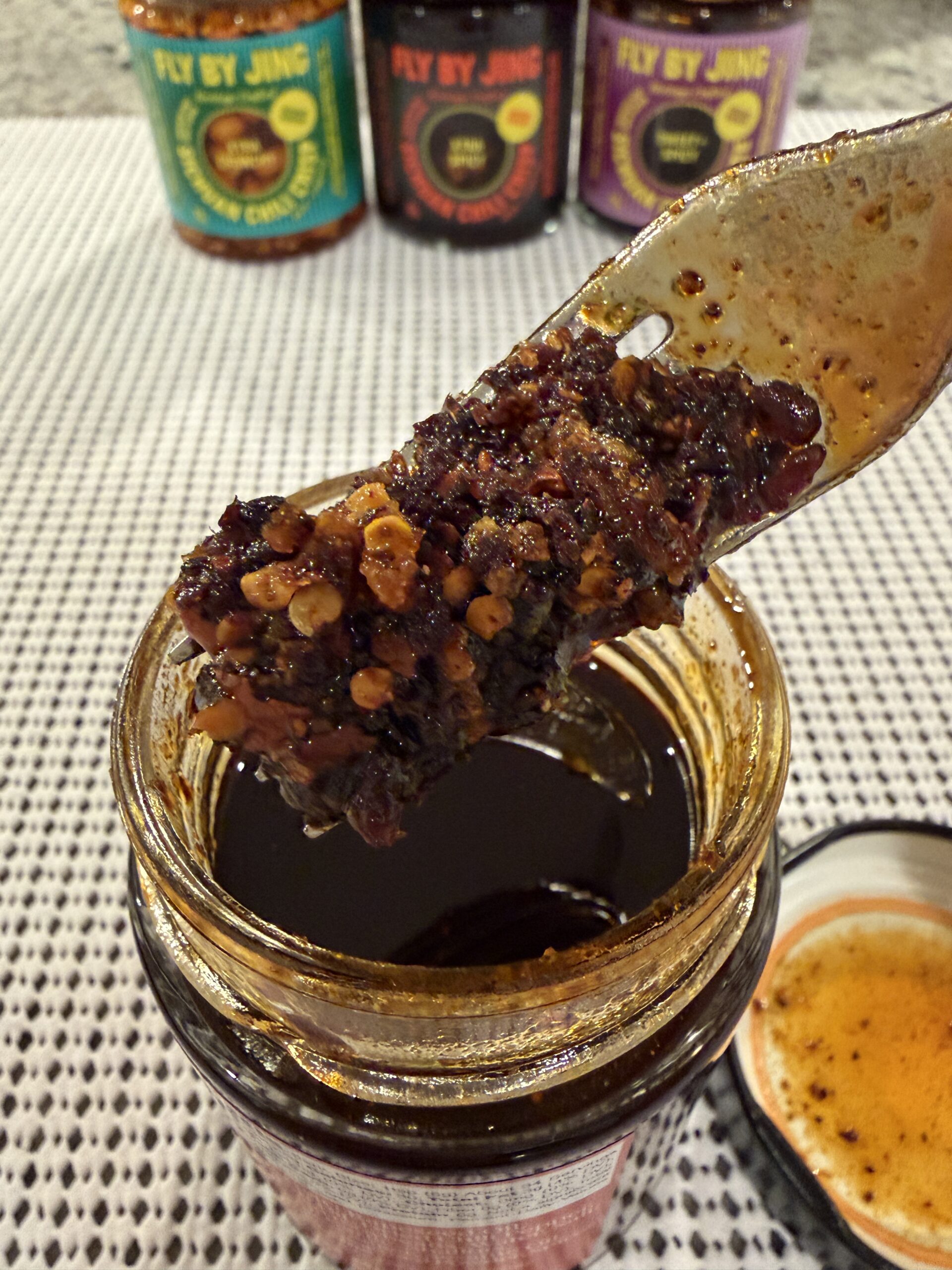 Fly By Jing Chili Crisp fork pull showing oil and sediment — Flavor Index Lab