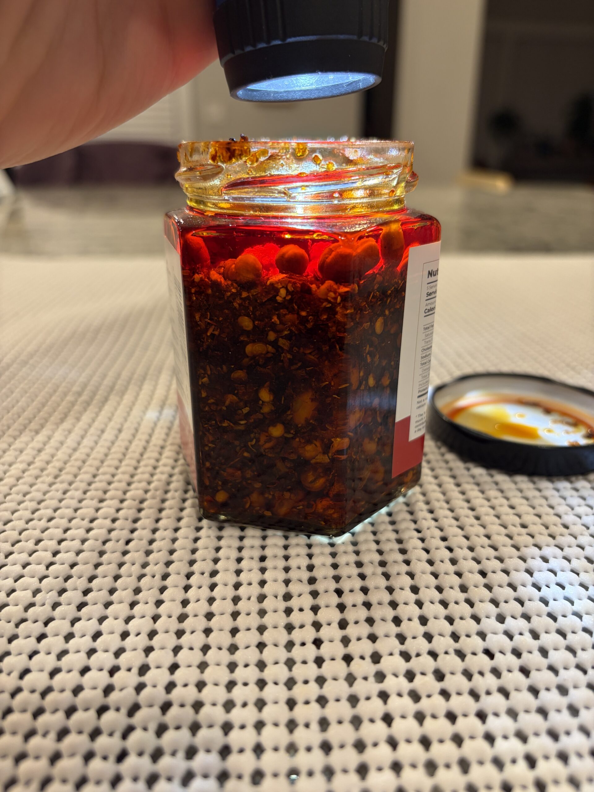 Fusion Select chili crisp settlement showing 80% solids with soybeans visible — Flavor Index Lab