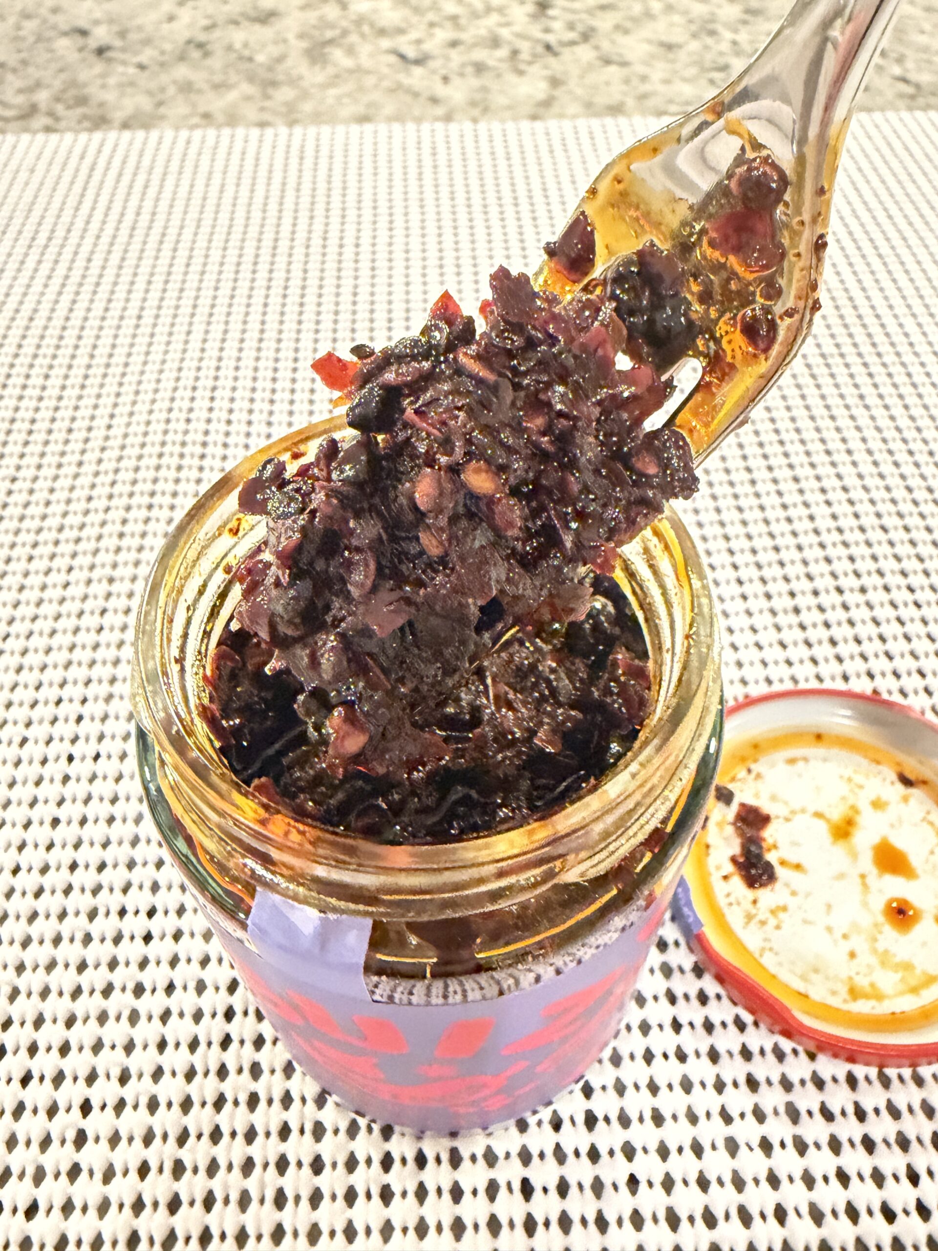 GUIZ black bean chili crisp fork pull showing chewy texture — Flavor Index Lab