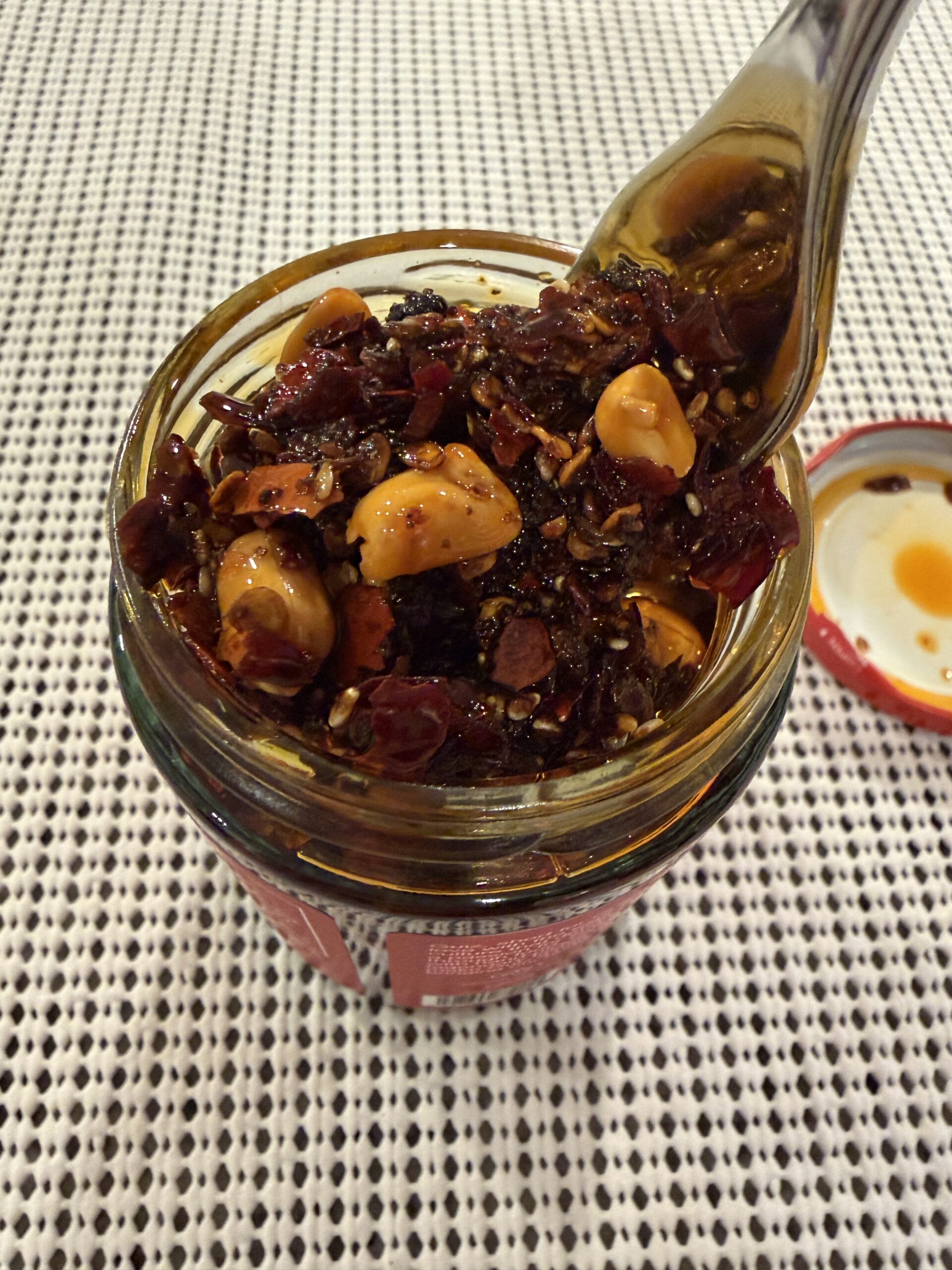 GUIZ chili crisp fork pull showing texture and oil — Flavor Index Lab