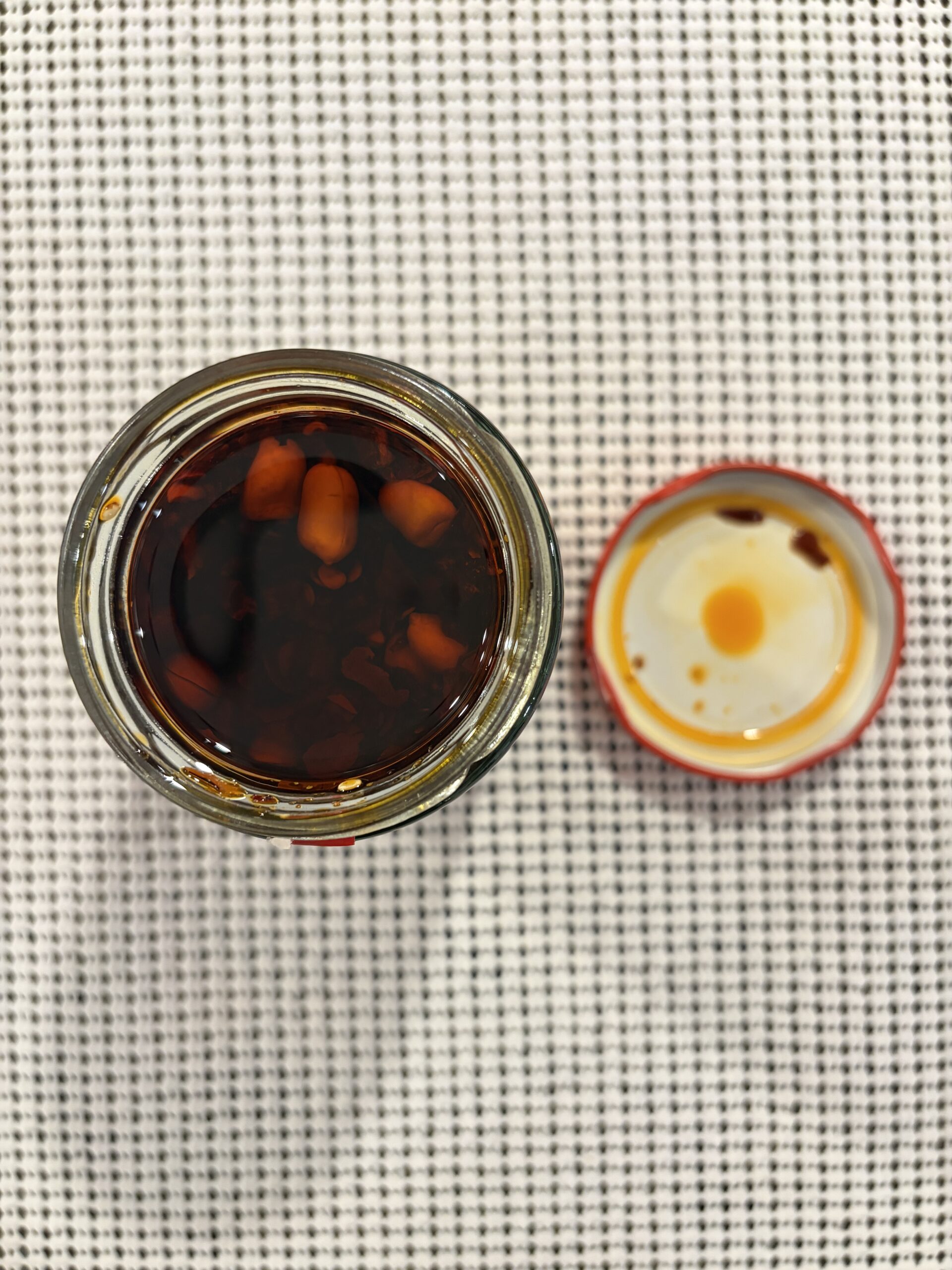 GUIZ chili crisp open jar showing crispy bits and peanuts — Flavor Index Lab