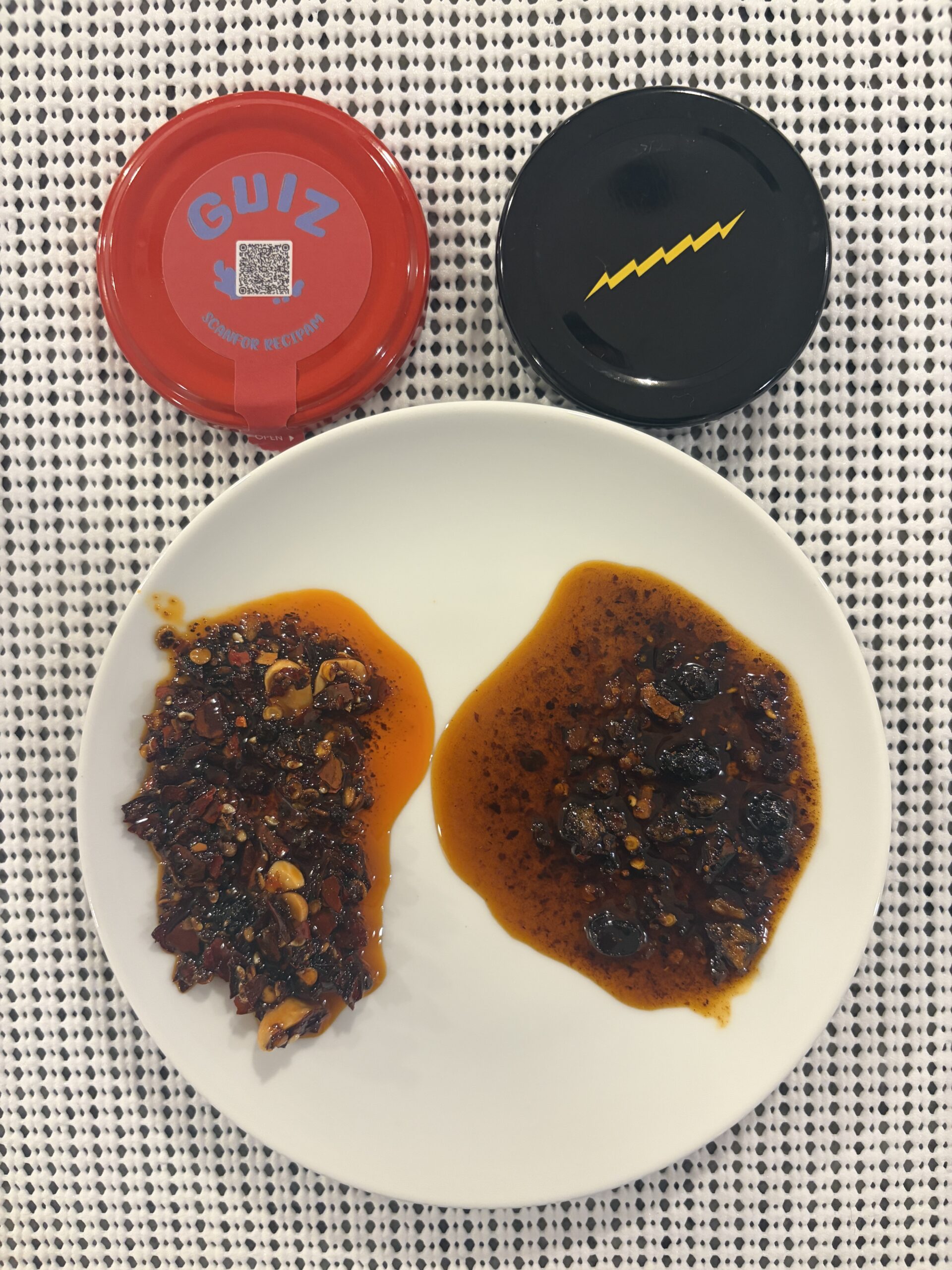 GUIZ and Fly By Jing chili crisp open jars showing settlement difference — Flavor Index Lab