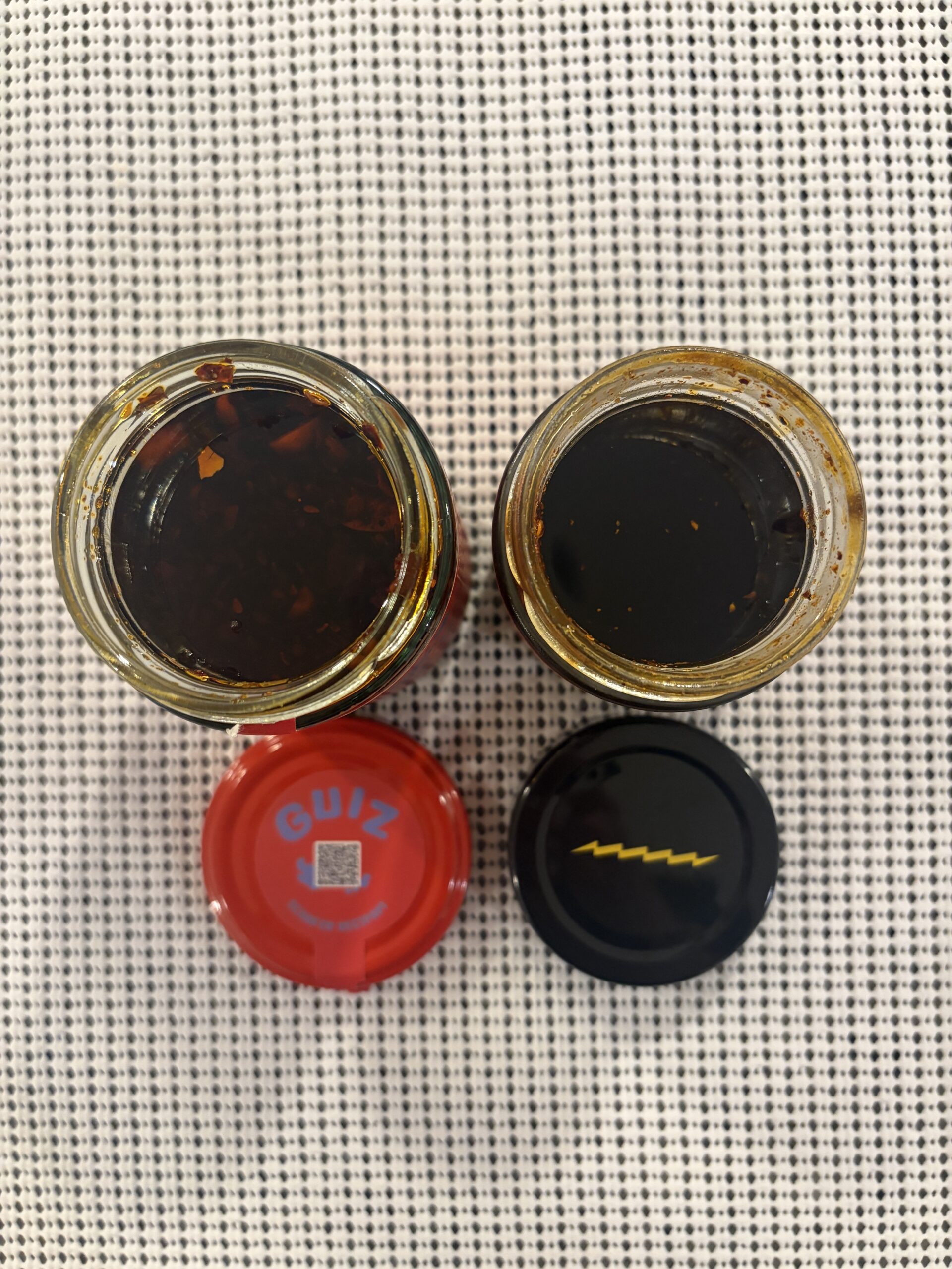GUIZ and Fly By Jing chili crisp jars side by side — Flavor Index Lab