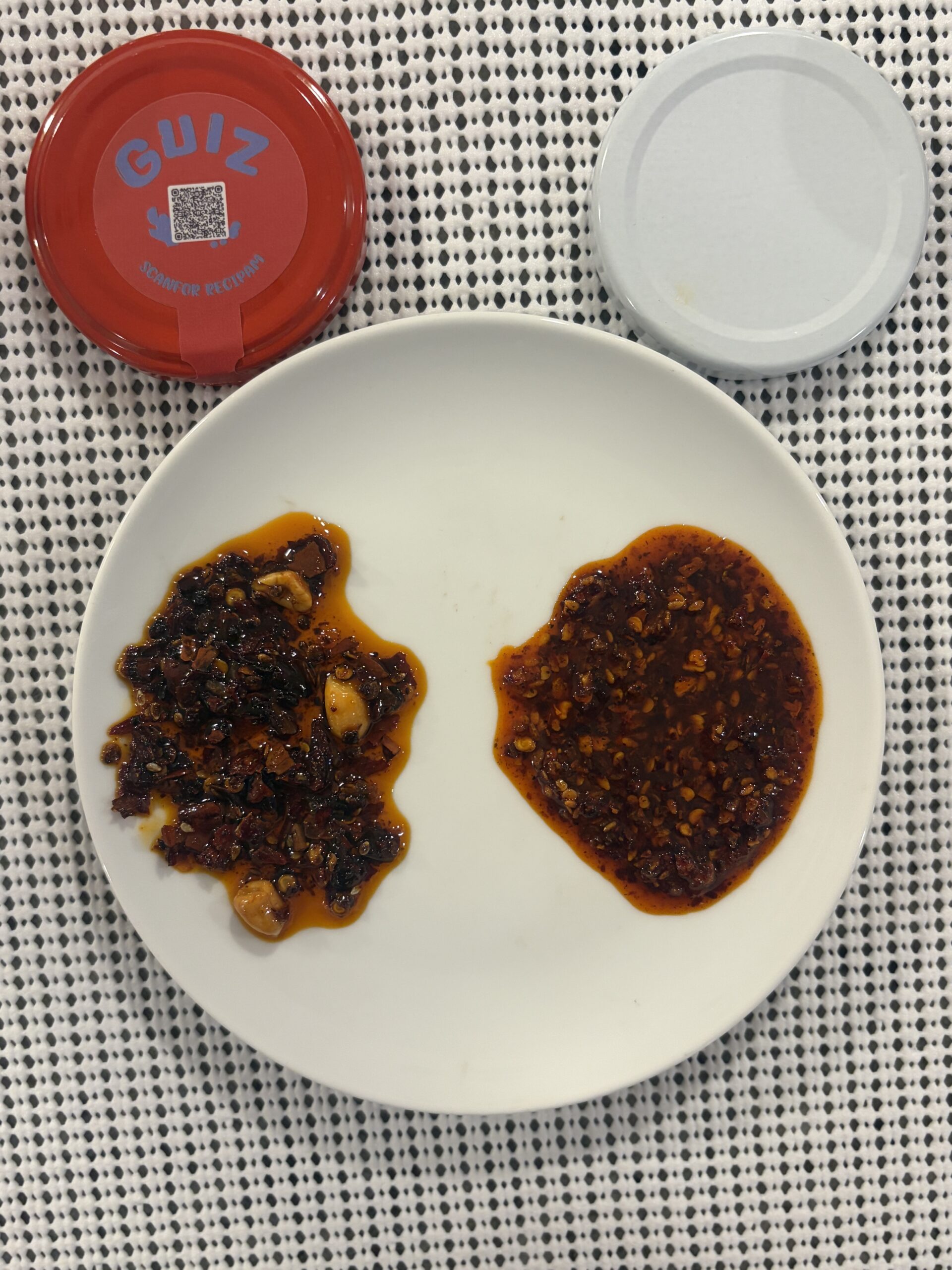 GUIZ vs Momofuku chili crisp spread on plate showing color and texture difference — Flavor Index Lab