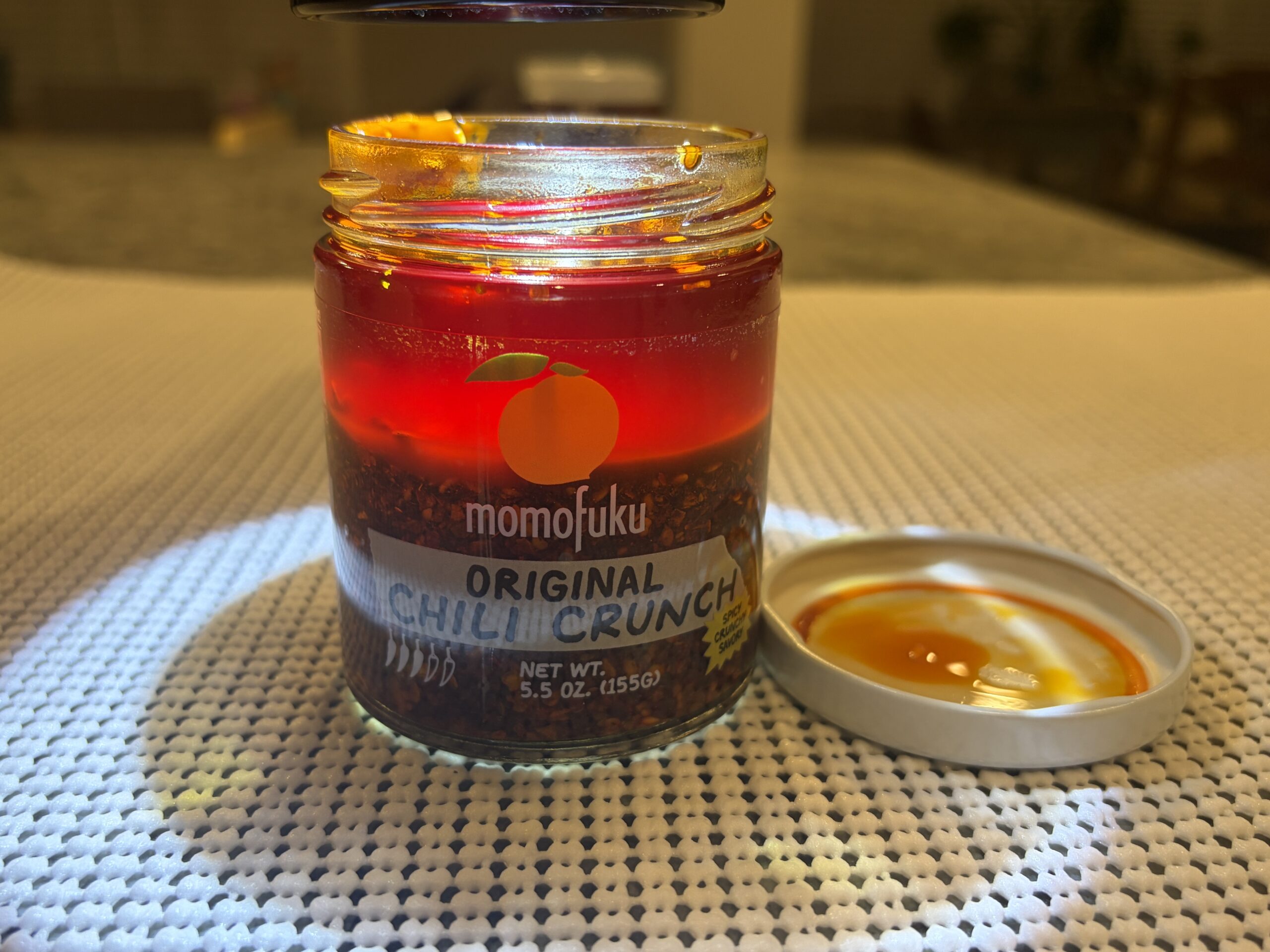 Momofuku Chili Crunch settlement showing red oil and uniform chili flakes — Flavor Index Lab