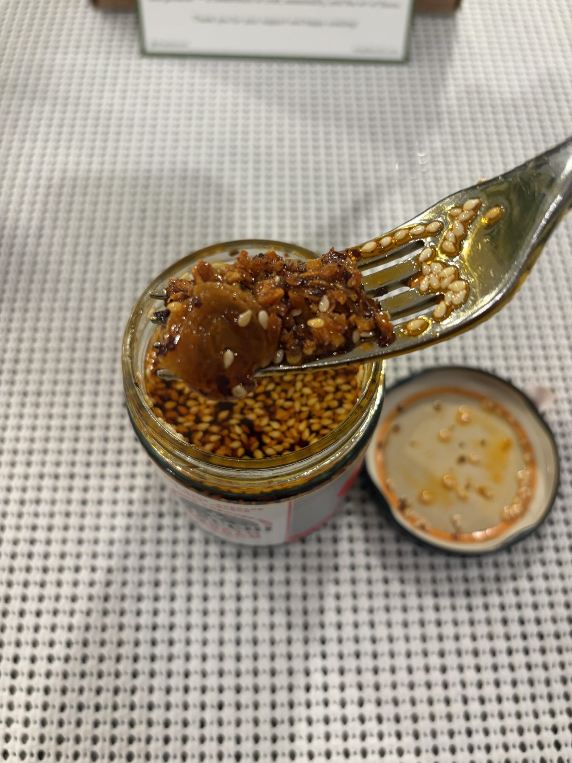 Ikeuchi Bonito Crunch chili crisp fork pull close-up — Flavor Index Lab