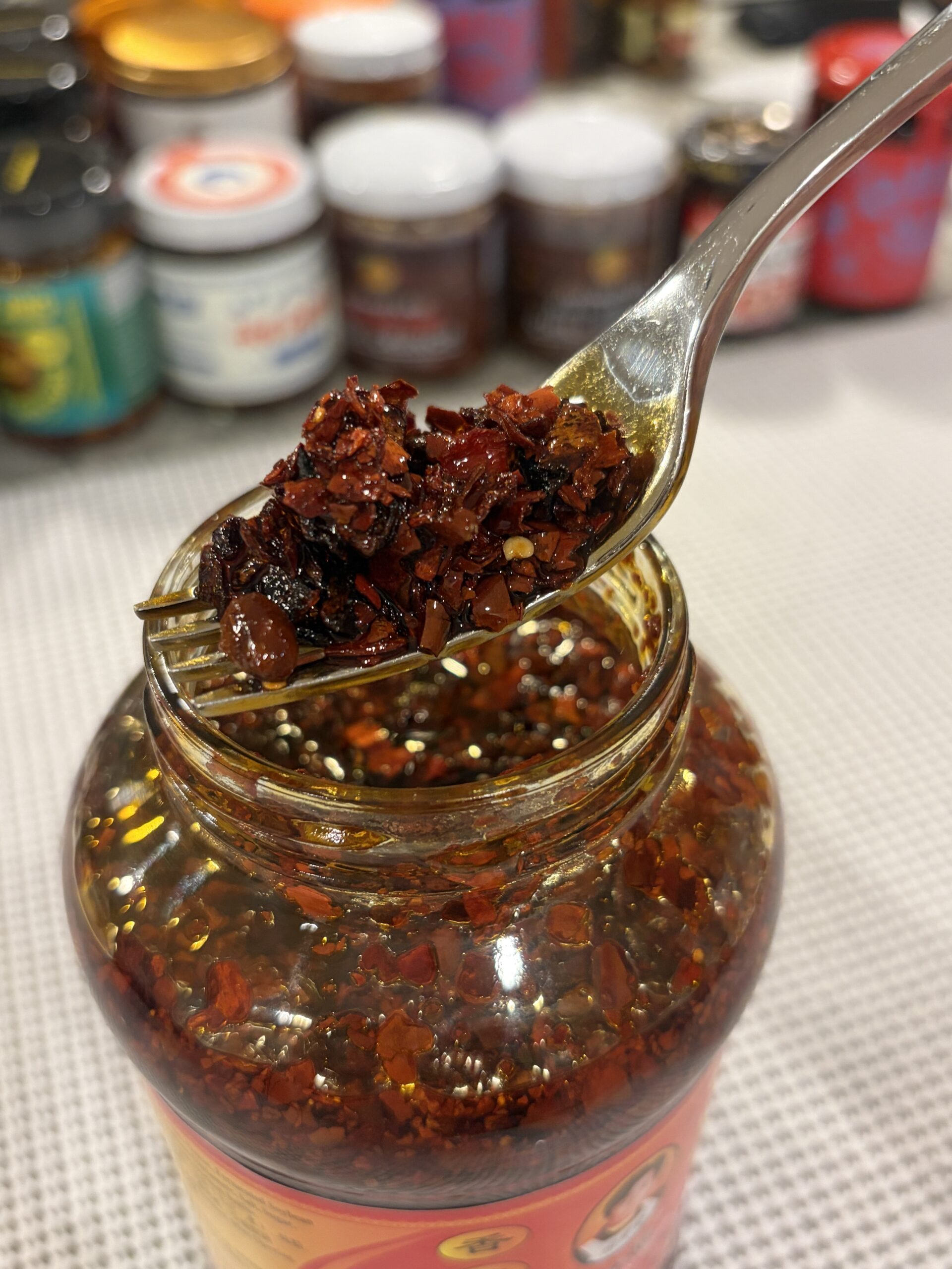 Lao Gan Ma chili crisp fork pull showing oil-to-solids ratio — Flavor Index Lab