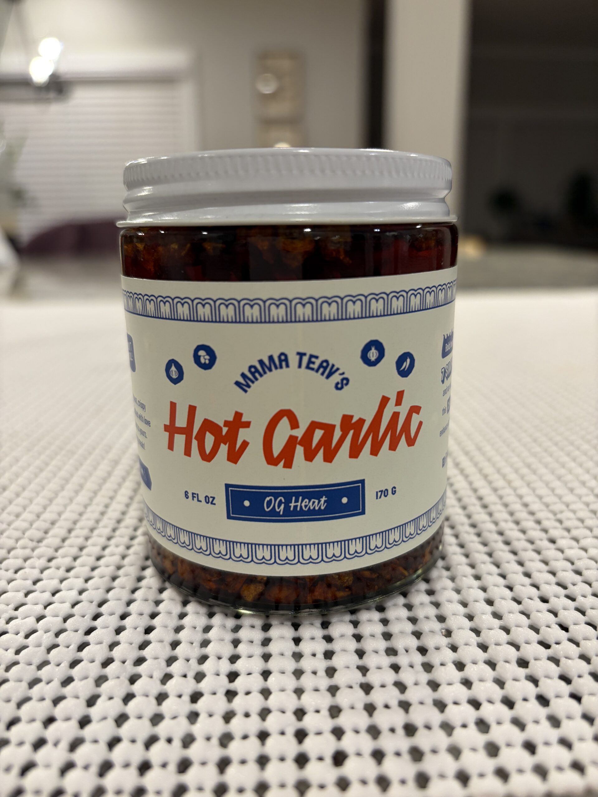 Mama Teav's Hot Garlic chili crisp jar showing brand label and heat rating — Flavor Index Lab