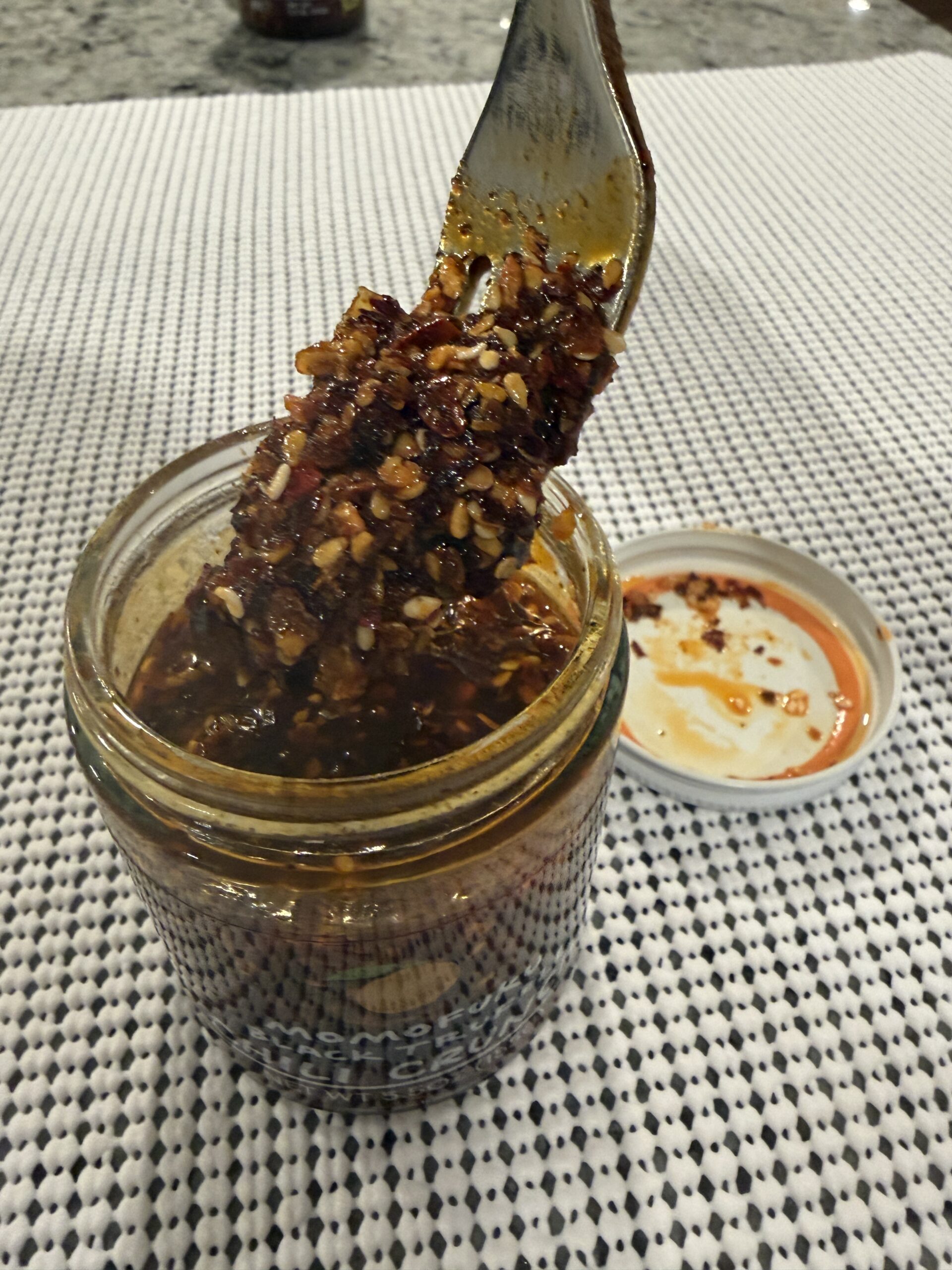 Momofuku Black Truffle Chili Crunch thick oil dripping from fork — Flavor Index Lab