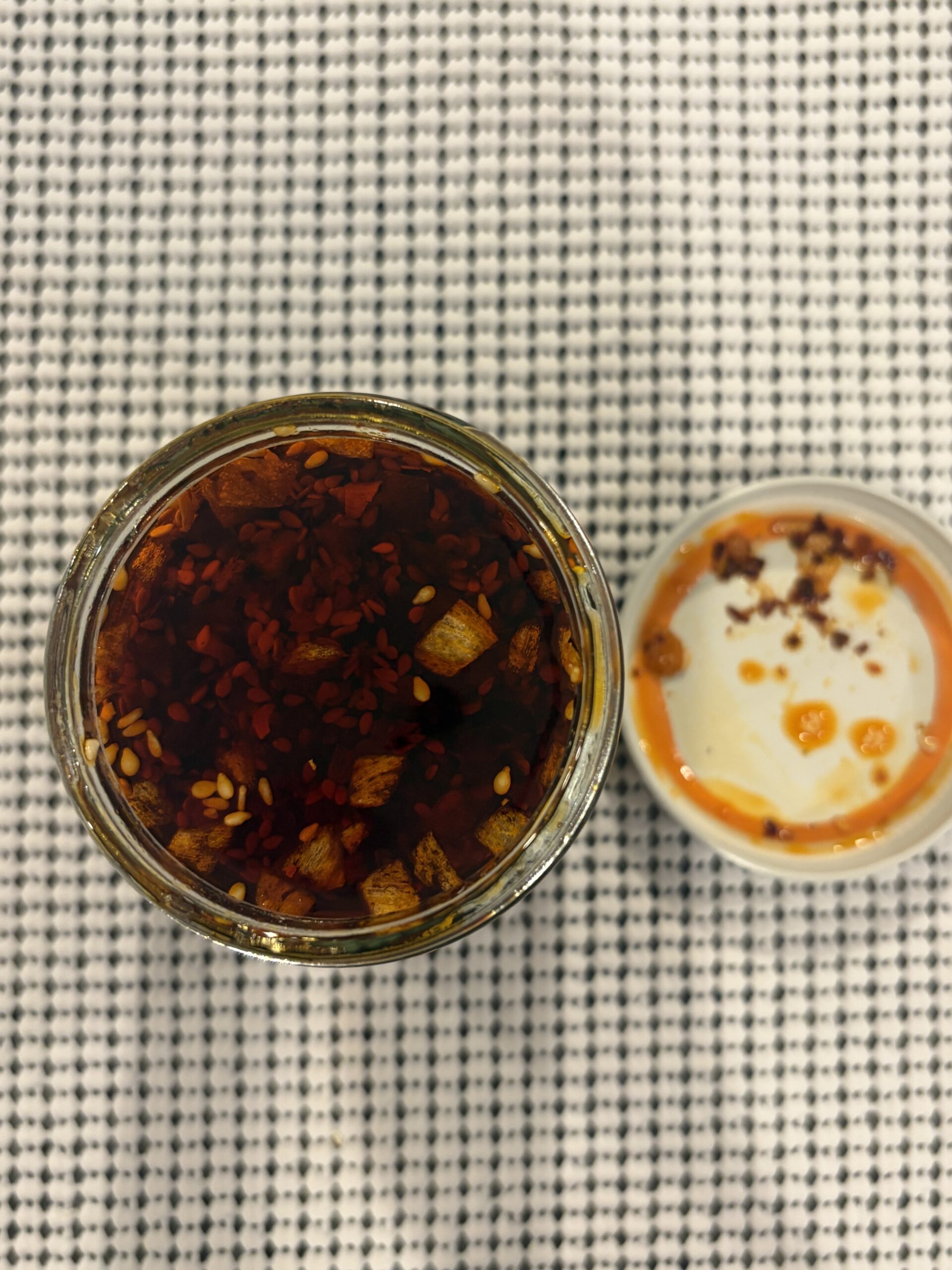 Momofuku Black Truffle Chili Crunch open jar showing chili bits and truffle — Flavor Index Lab