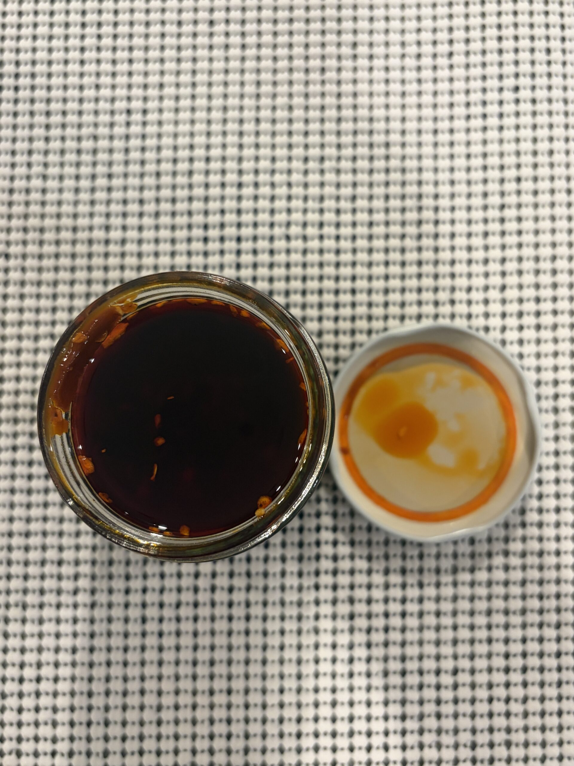 Momofuku Chili Crunch open jar showing fried garlic and shallots in oil — Flavor Index Lab