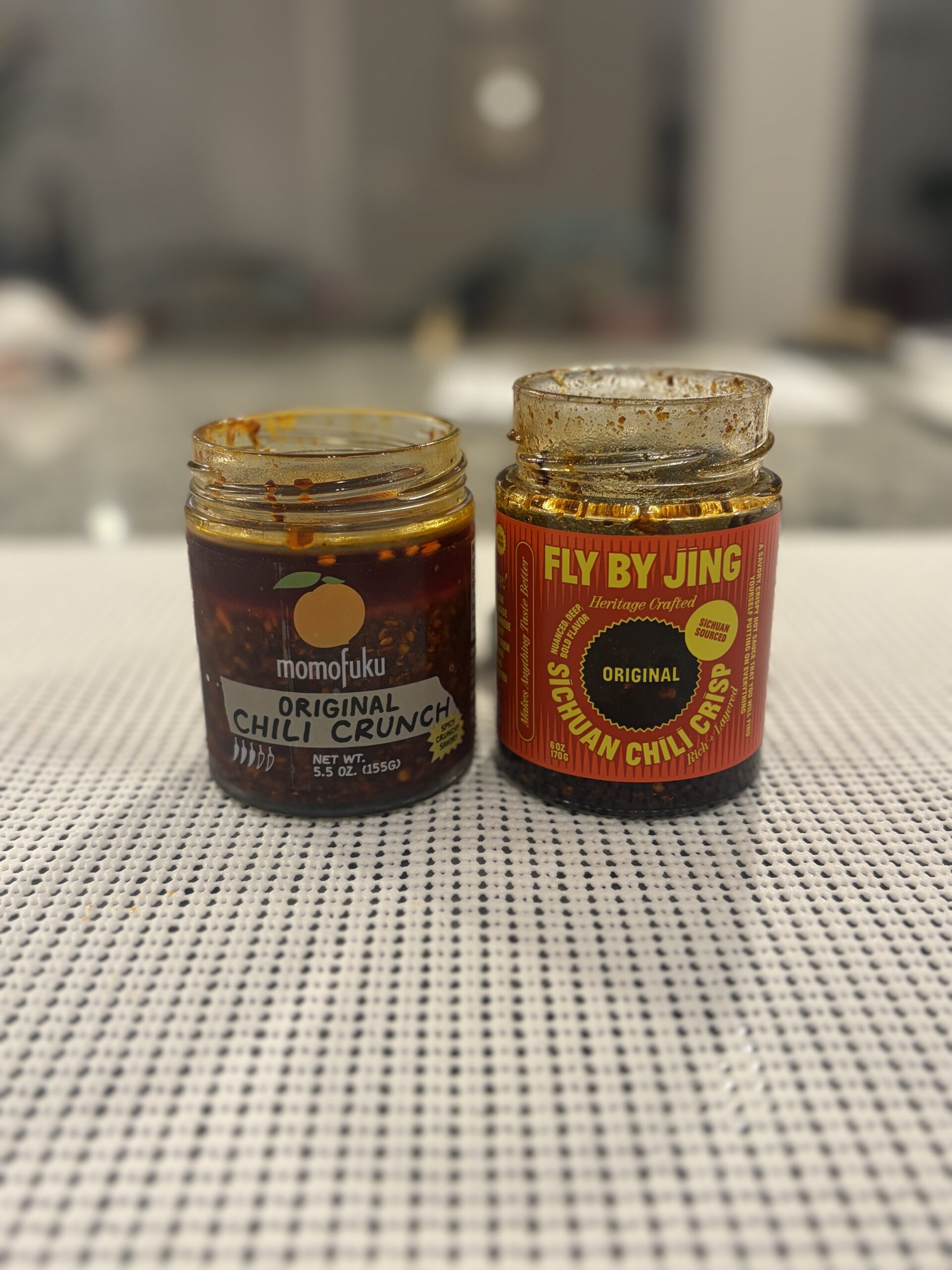 Momofuku Chili Crunch and Fly By Jing chili crisp jar labels compared — Flavor Index Lab