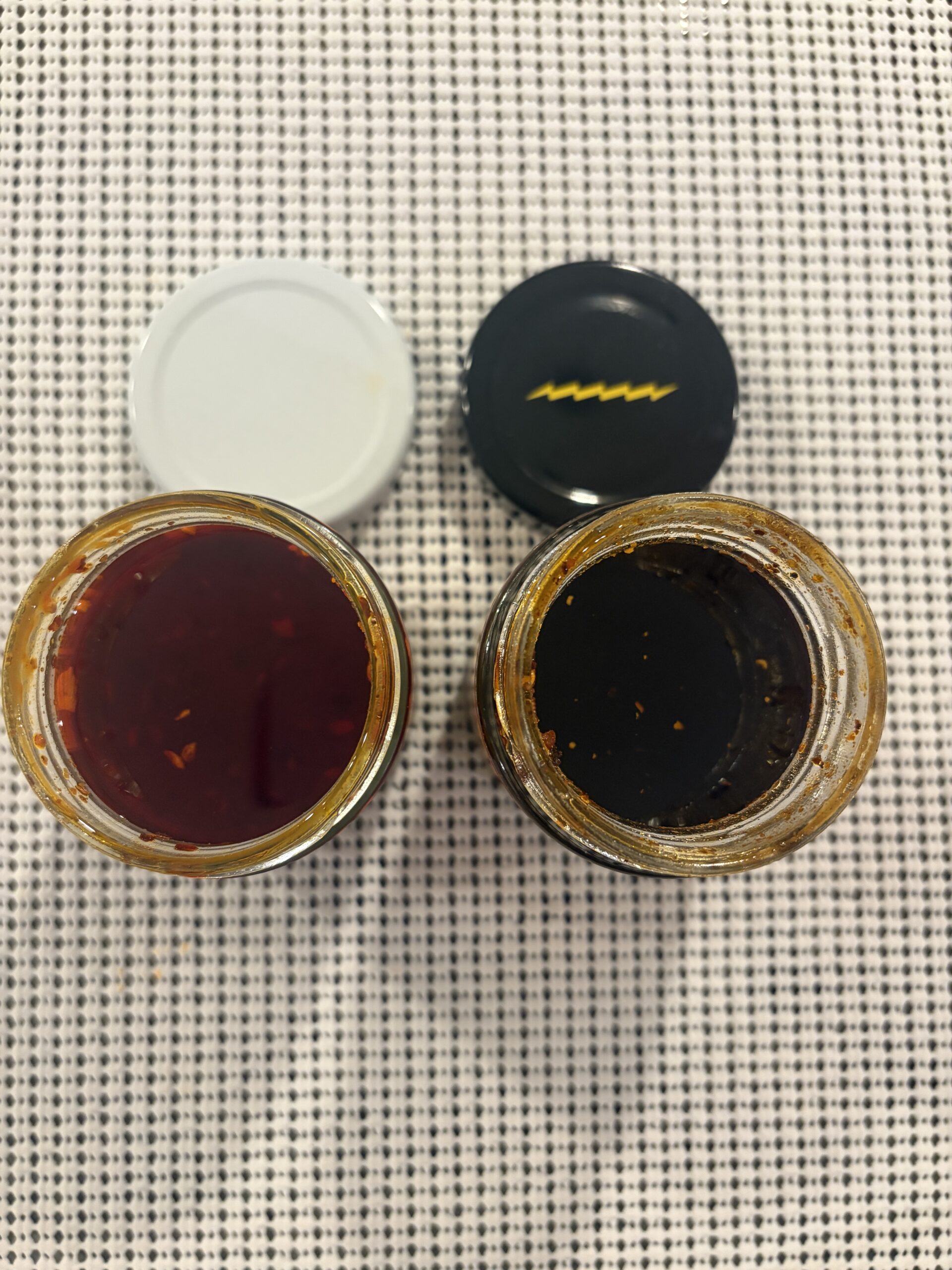 Momofuku and Fly By Jing chili crisp jars side by side — Flavor Index Lab
