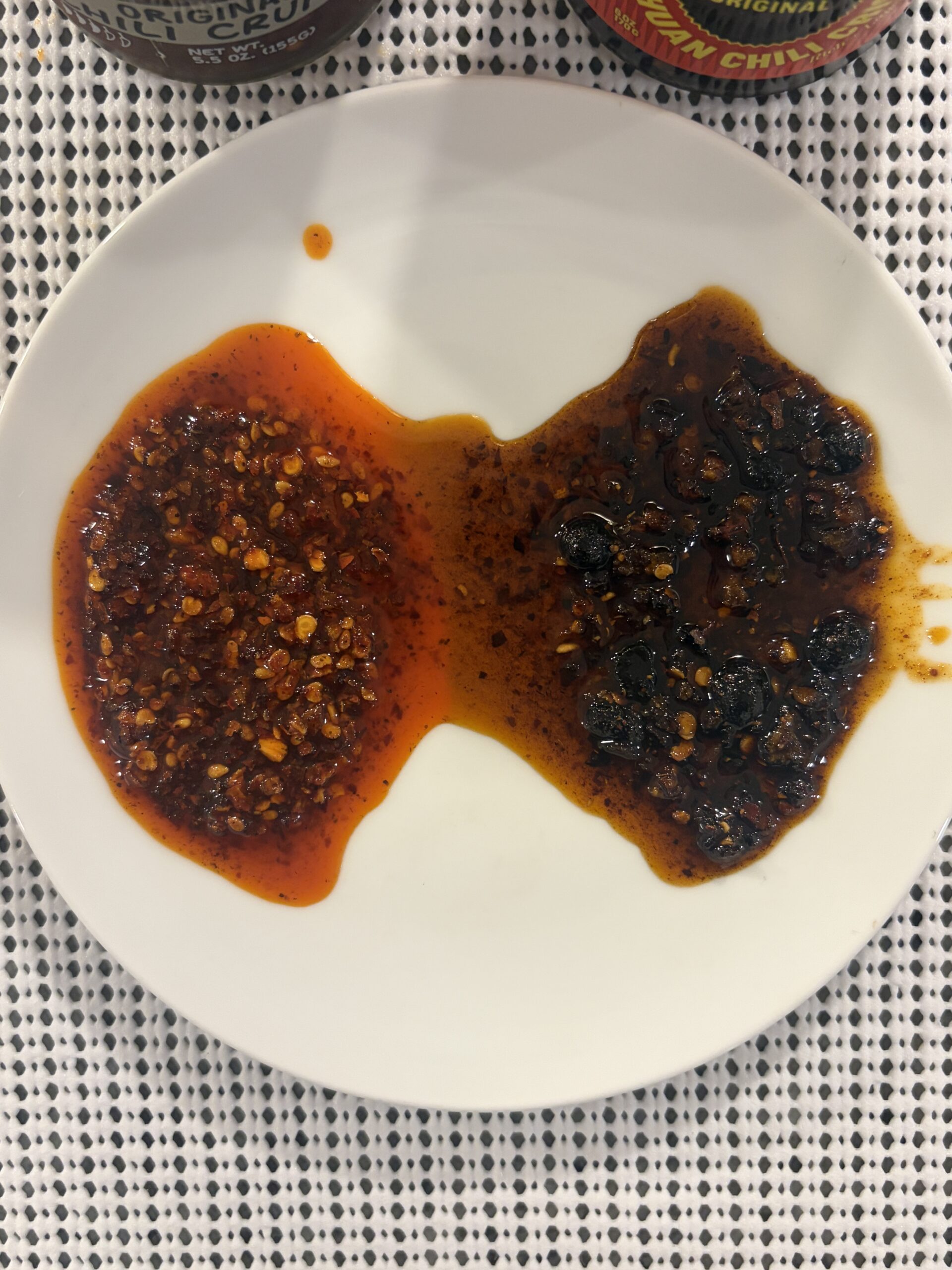 Momofuku vs Fly By Jing chili crisp spread on white plate for comparison — Flavor Index Lab