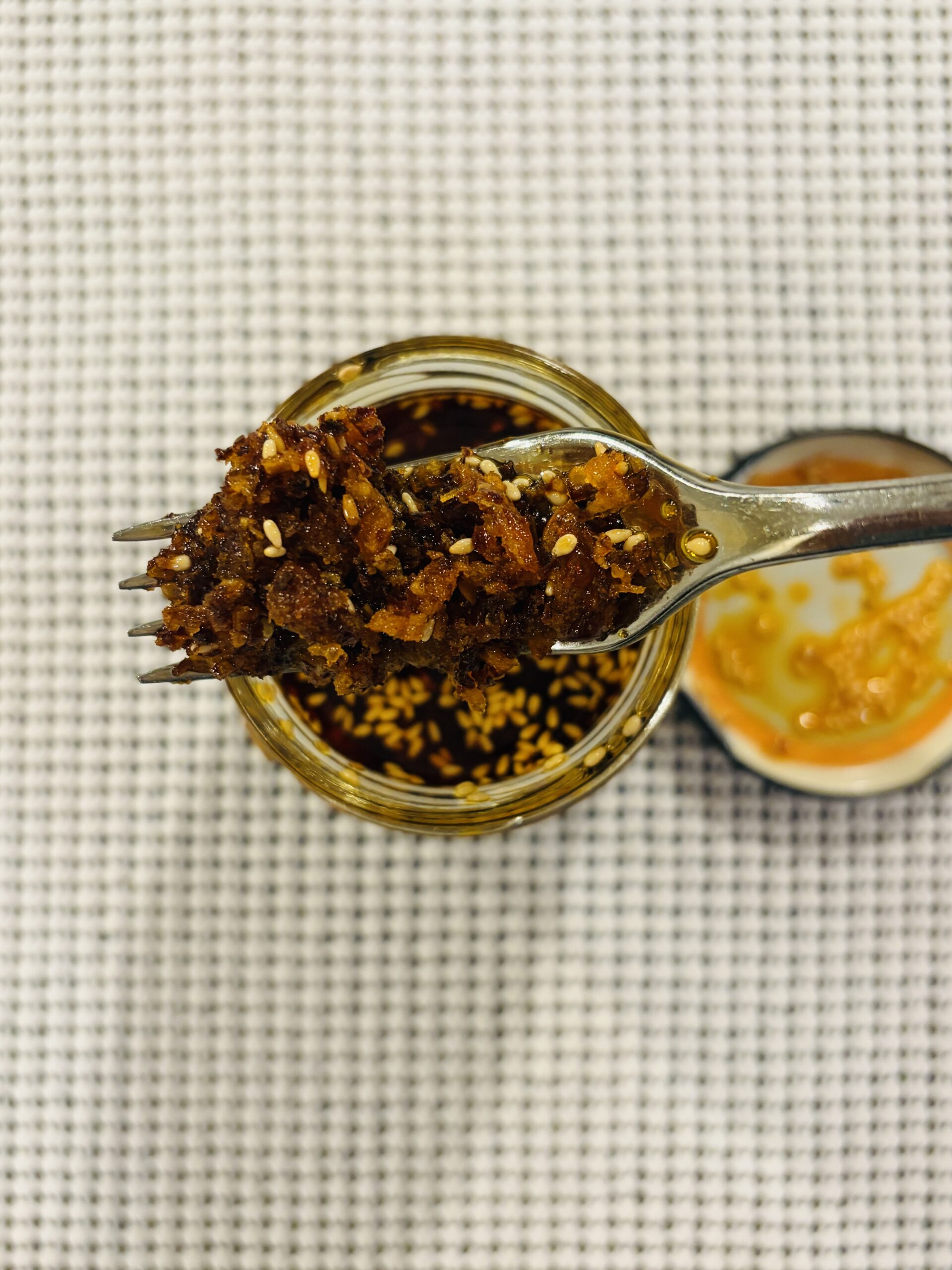 Pono Hawaiian chili crisp fork pull showing texture — Flavor Index Lab