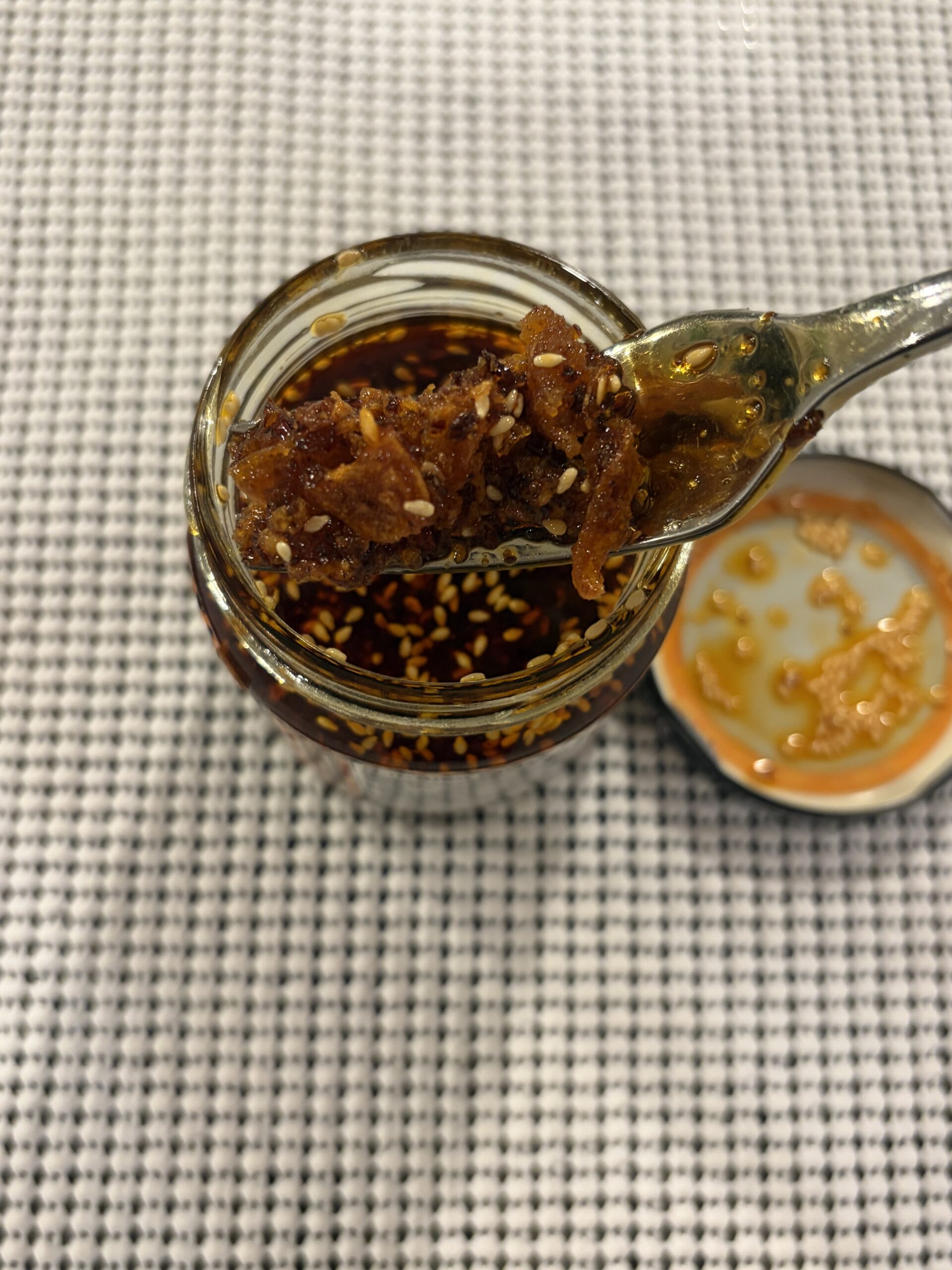 Fork resting on Pono Hawaiian chili crisp solids — Flavor Index Lab