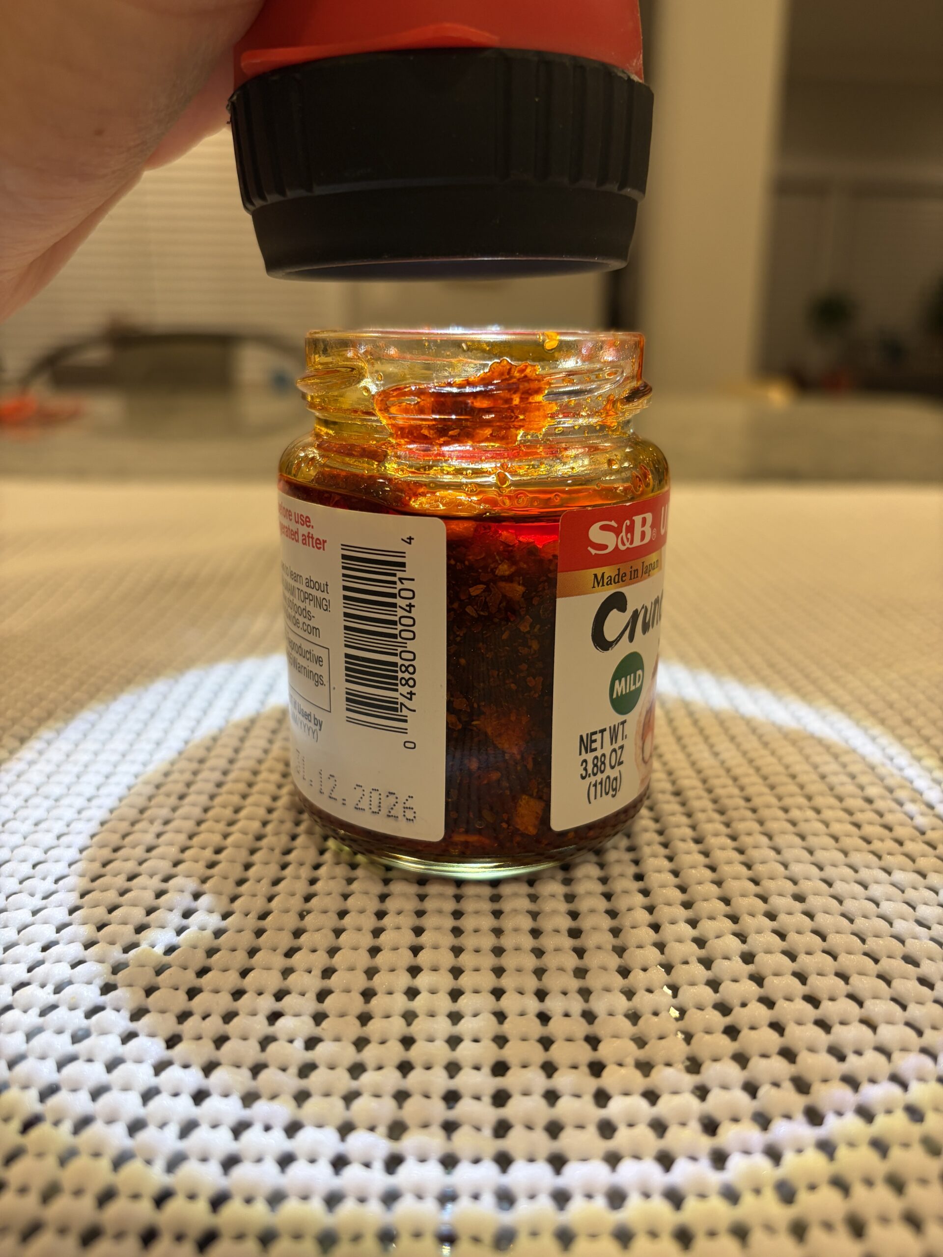 S&B chili crisp settlement showing dense solids with thin oil layer — Flavor Index Lab