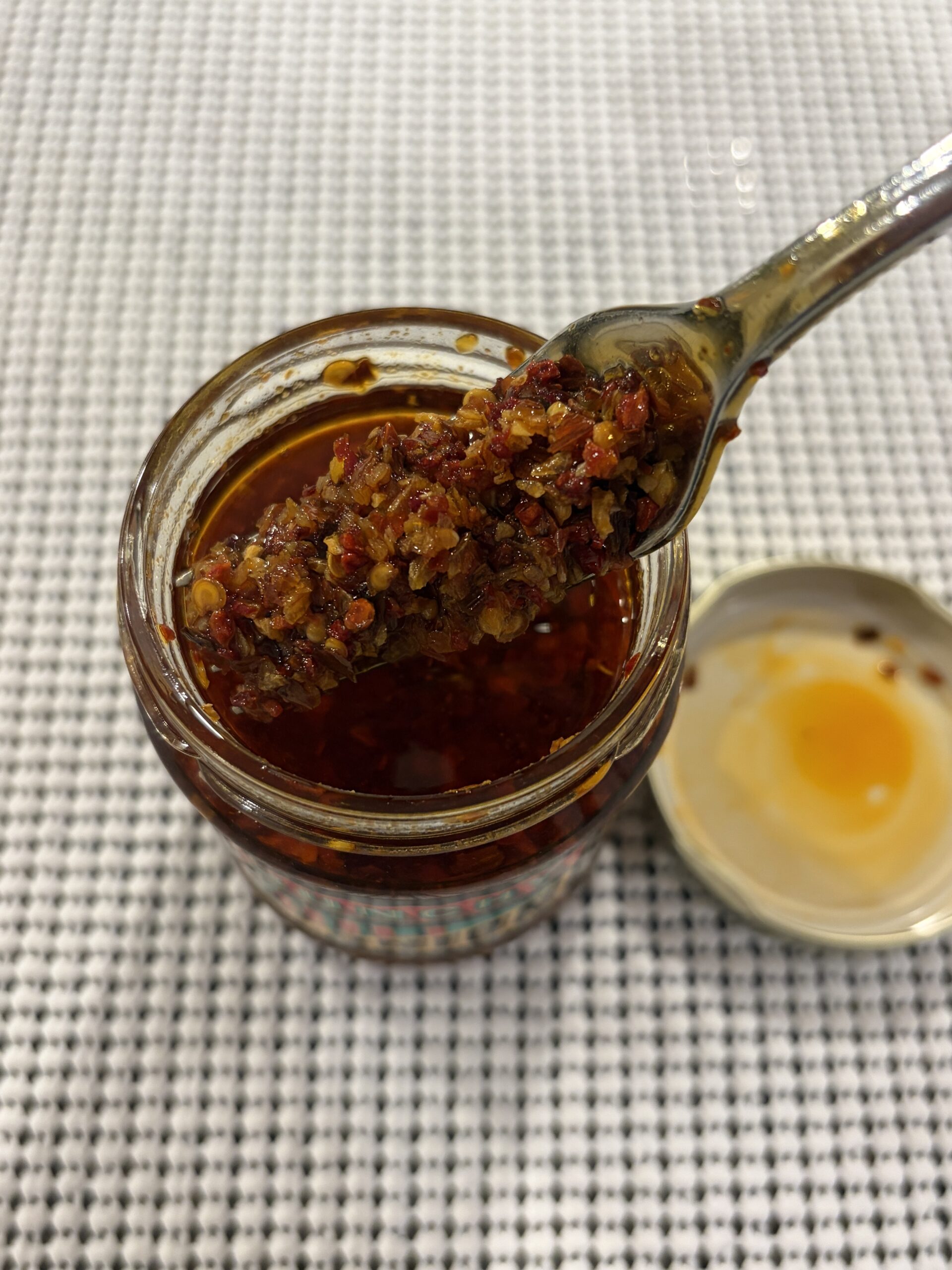 Trader Joe’s Chili Onion Crunch fork pull showing crispy onion and pepper bits — Flavor Index Lab