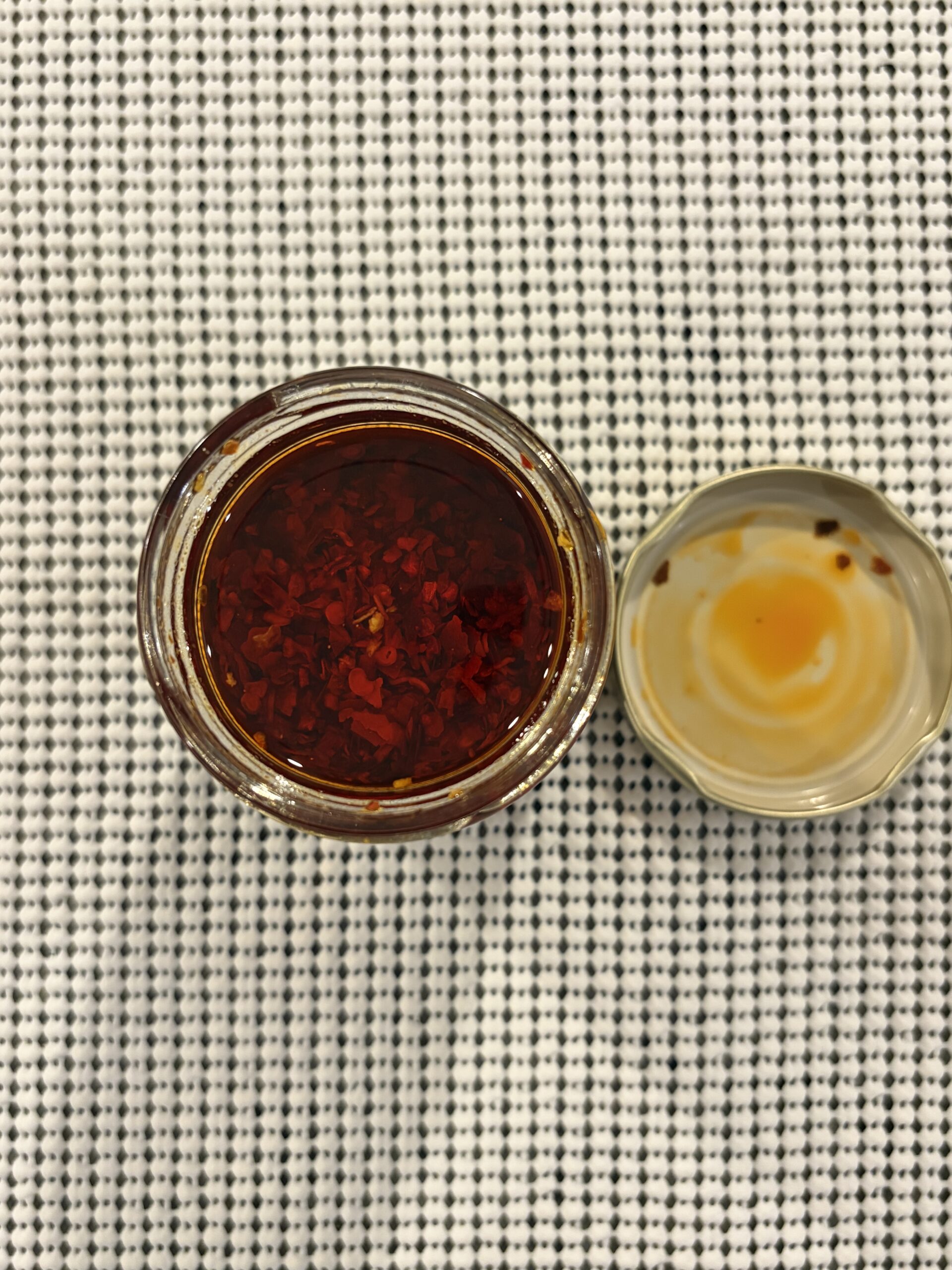 Trader Joe’s Chili Onion Crunch open jar showing olive oil and crispy bits — Flavor Index Lab