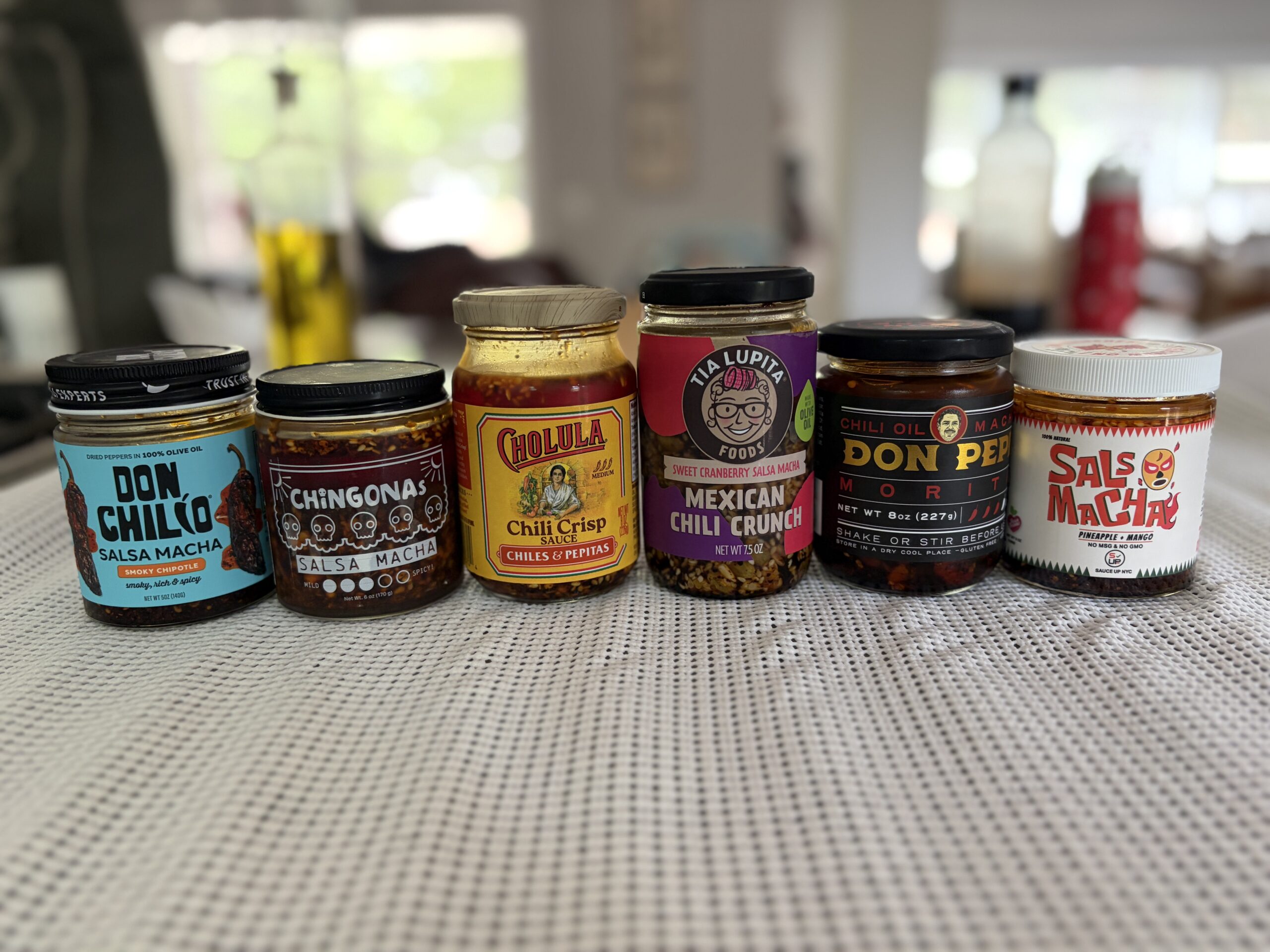 Best salsa macha jars — Don Chilio, CHiNGONAs, Cholula, Tia Lupita, Don Pepe, and Sauce Up lined up for comparison — Flavor Index Lab