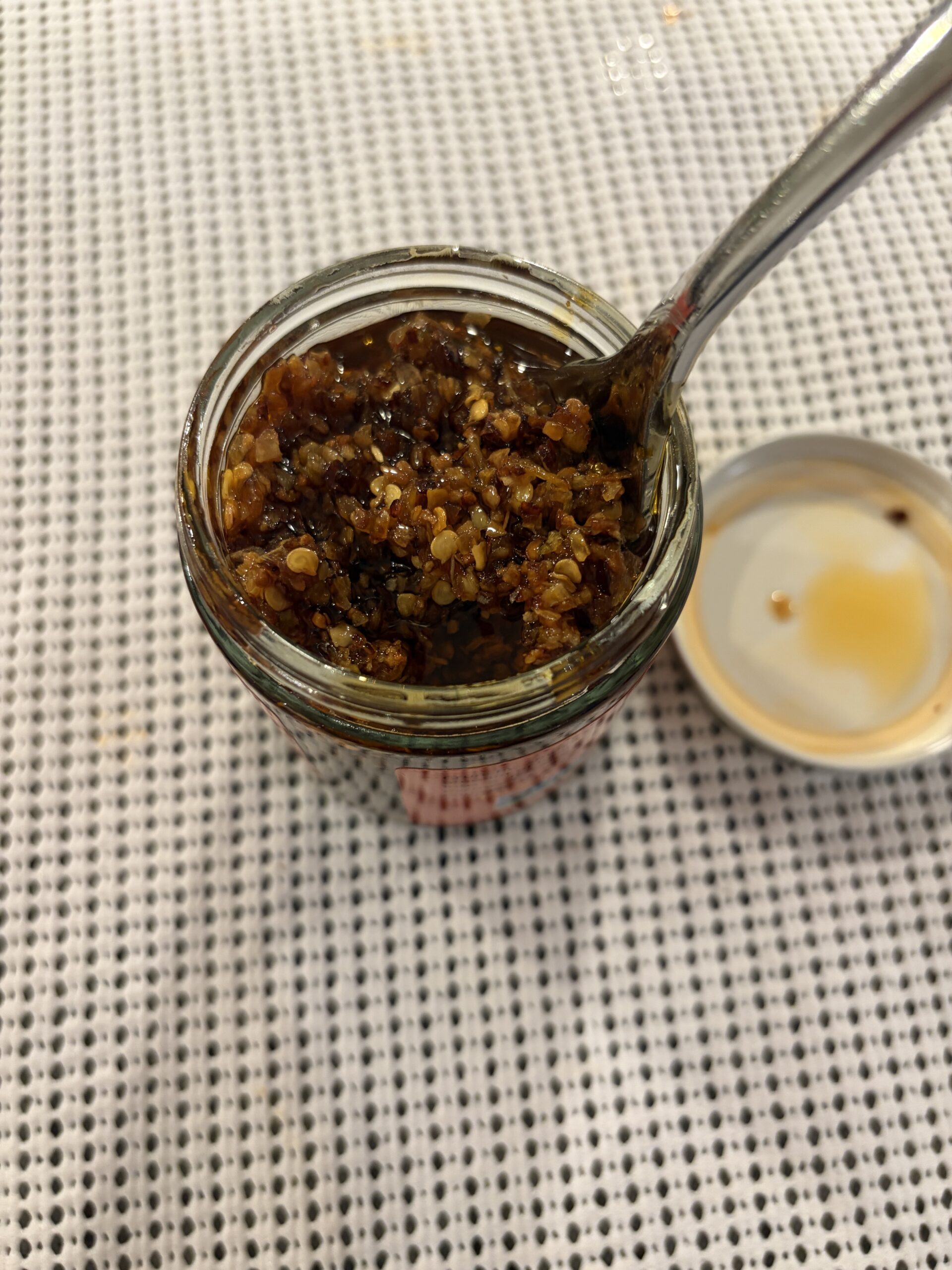 Chile Crunch chili crisp fork pull showing crunchy bits — Flavor Index Lab