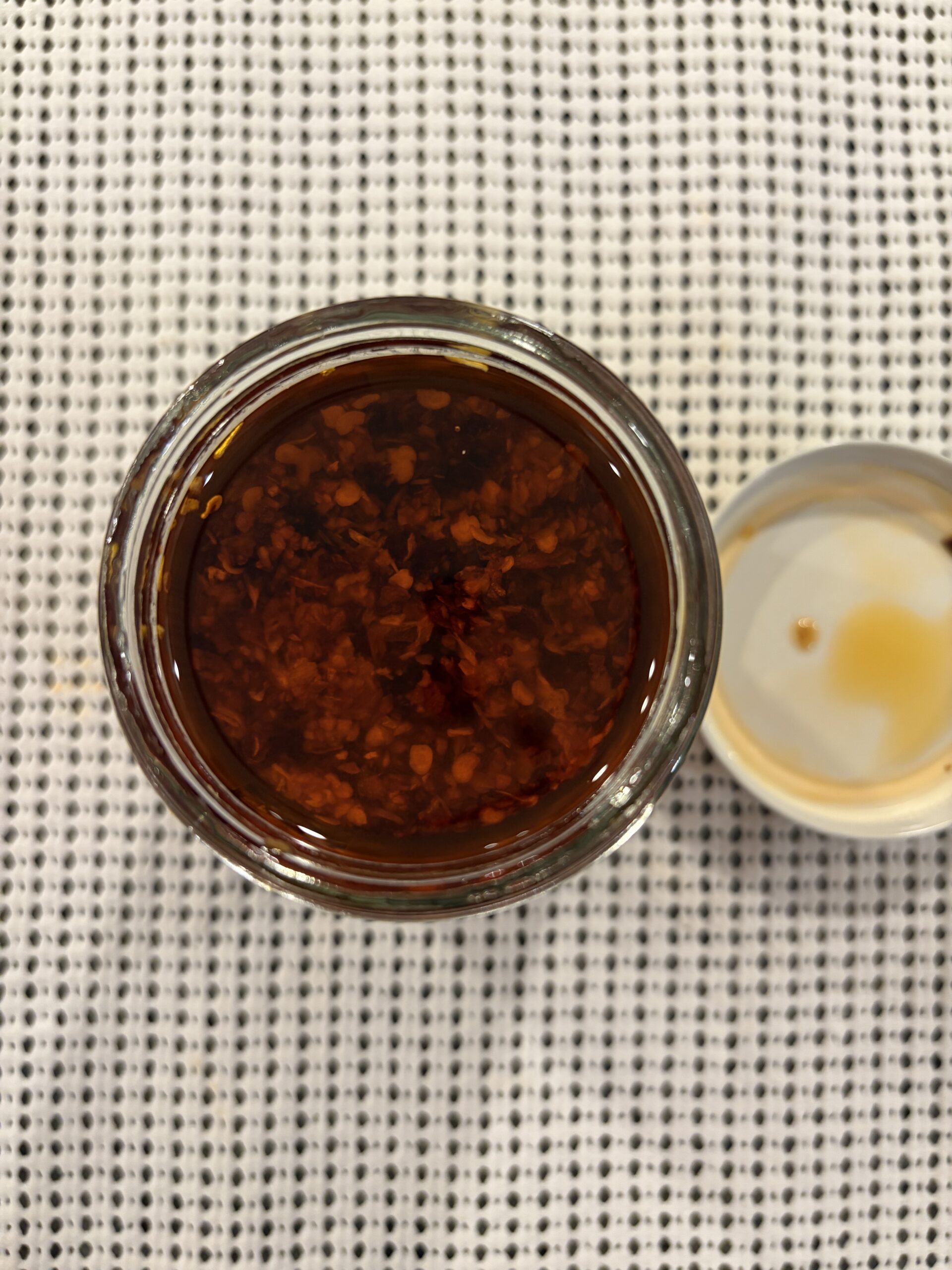 Chile Crunch review open jar showing granola-like fried bits — Flavor Index Lab