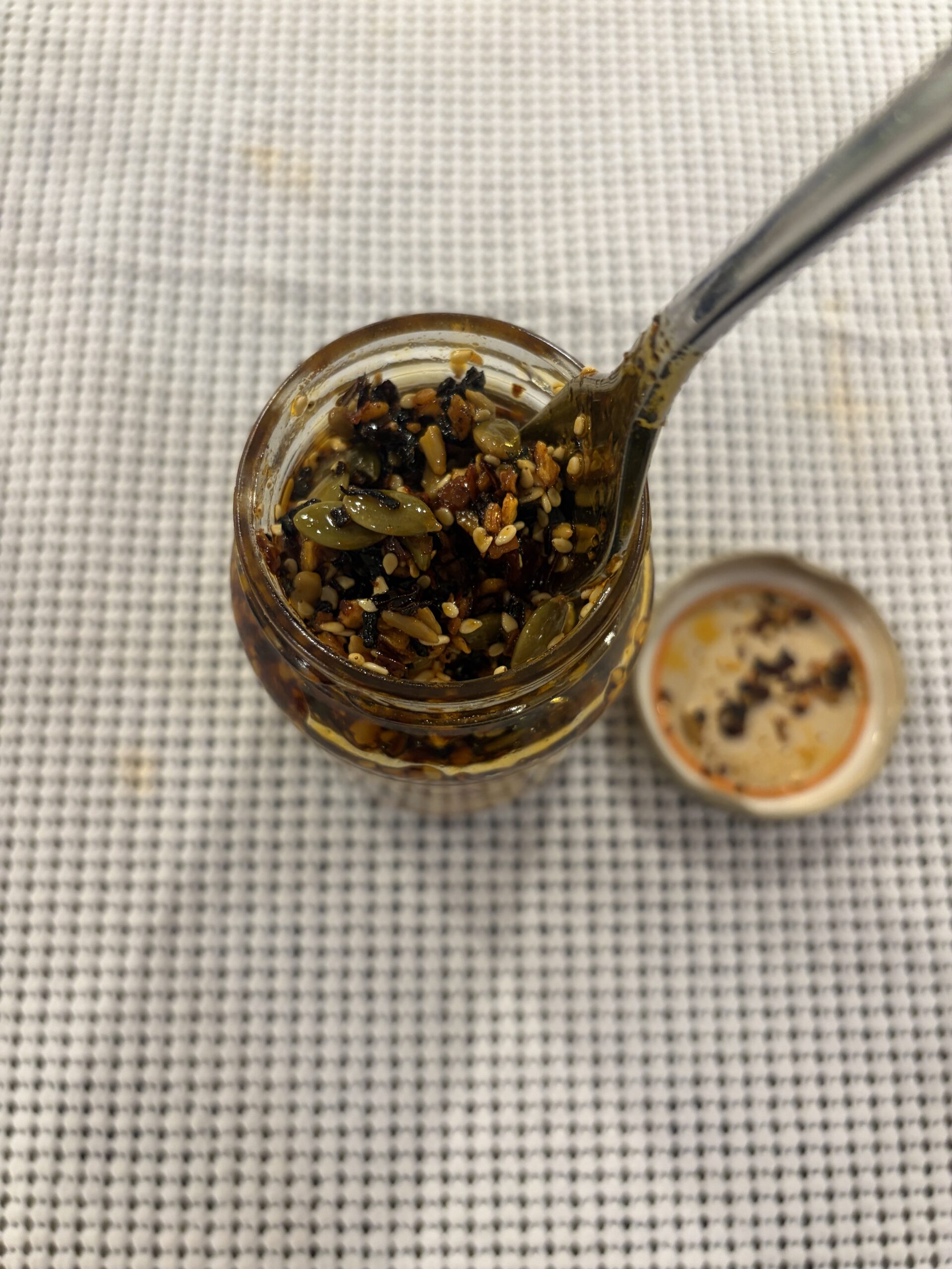 Cholula chili crisp chunks and seeds close-up — Flavor Index Lab