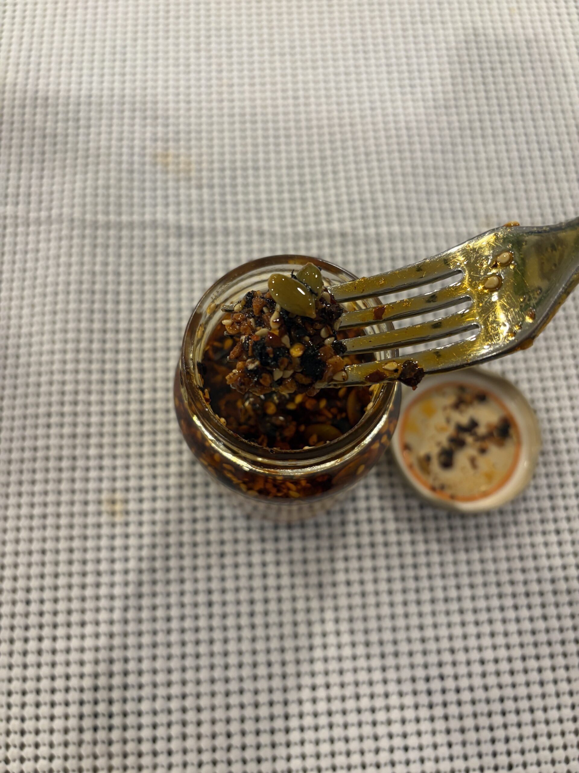 Cholula chili crisp fork pull showing thick texture — Flavor Index Lab