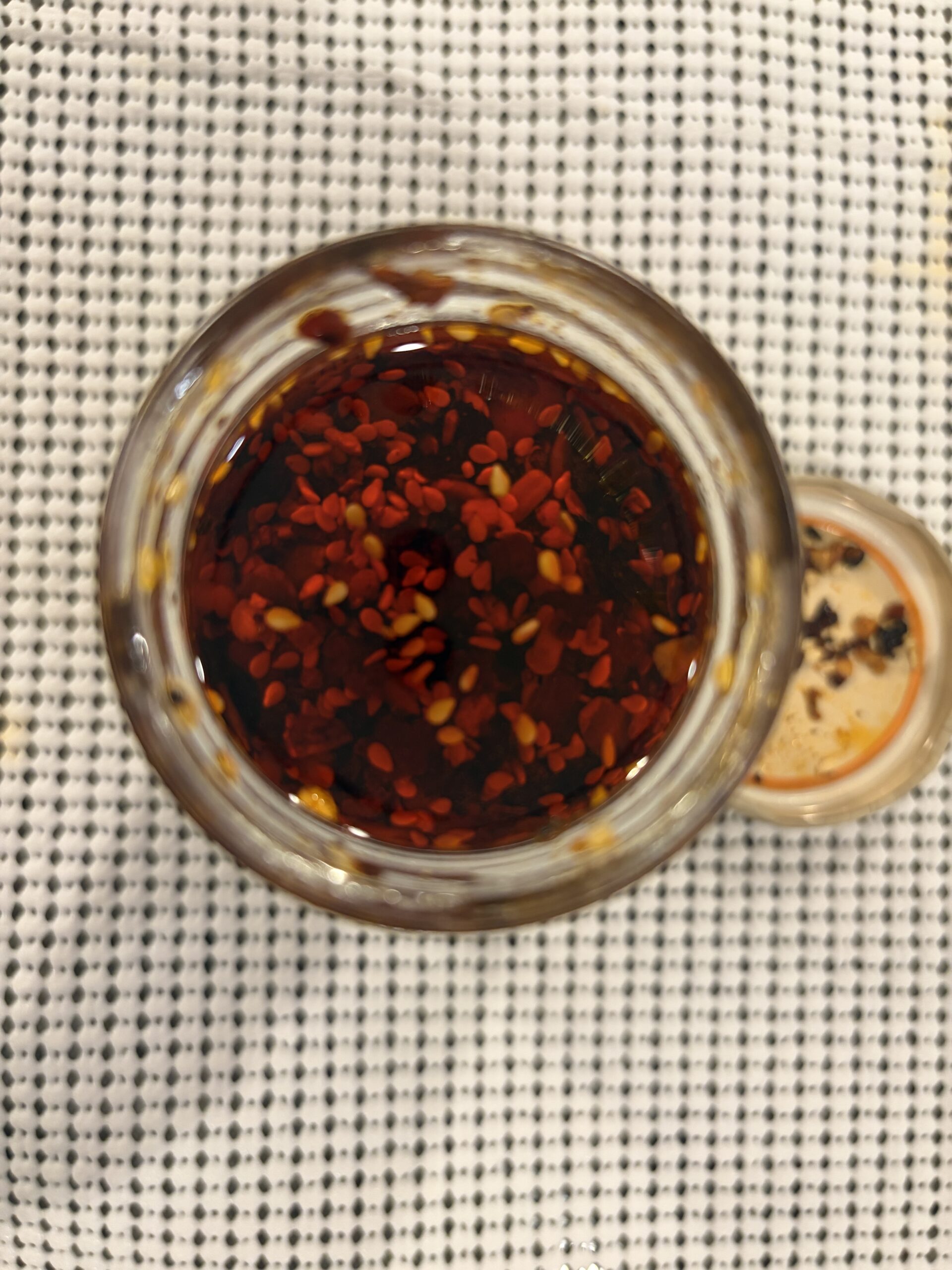 Cholula chili crisp open jar showing seeds and chili flakes — Flavor Index Lab
