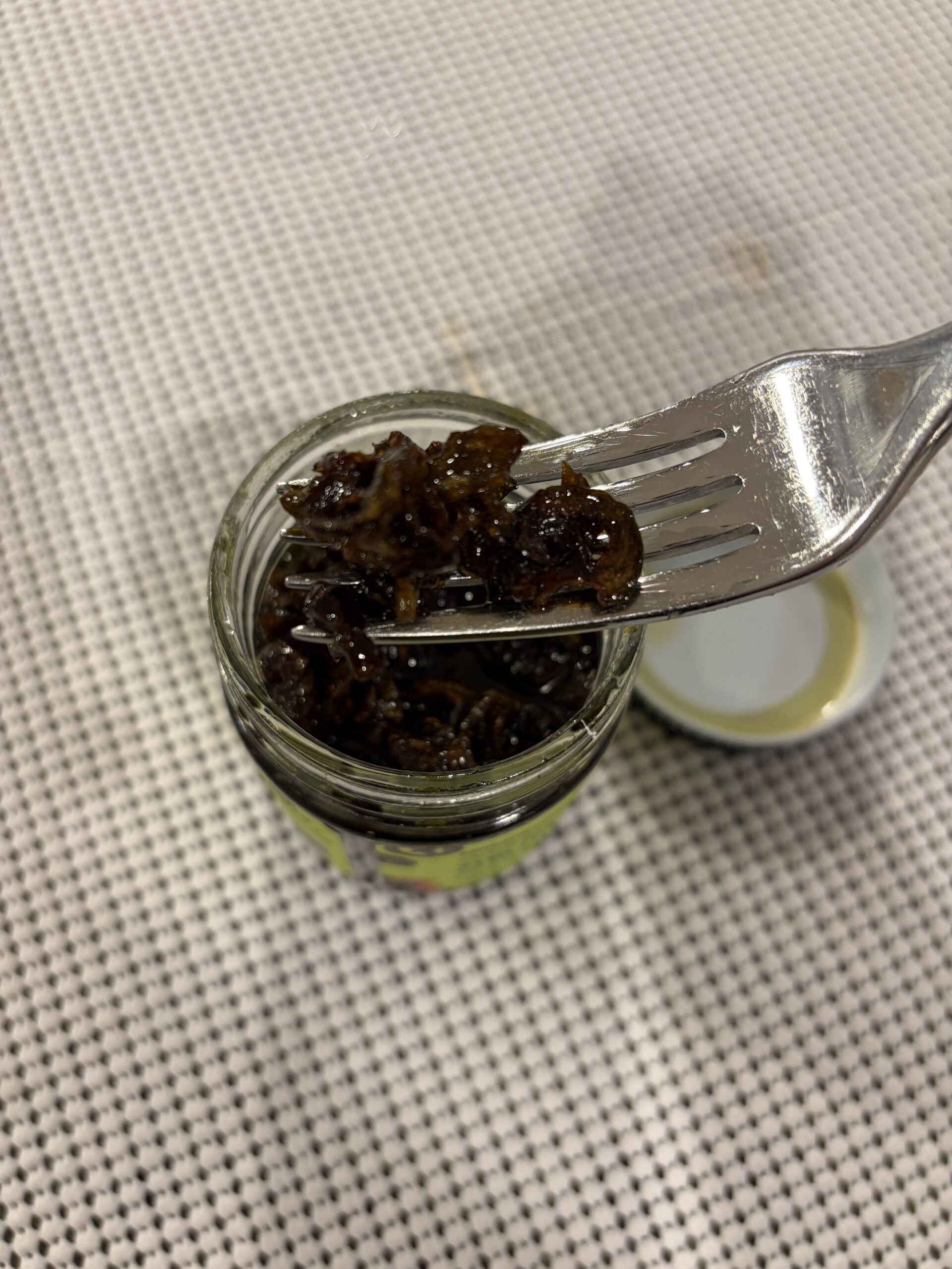 Don Chilio jalapeño chili crisp fork pull showing crispy peppers and olive oil — Flavor Index Lab