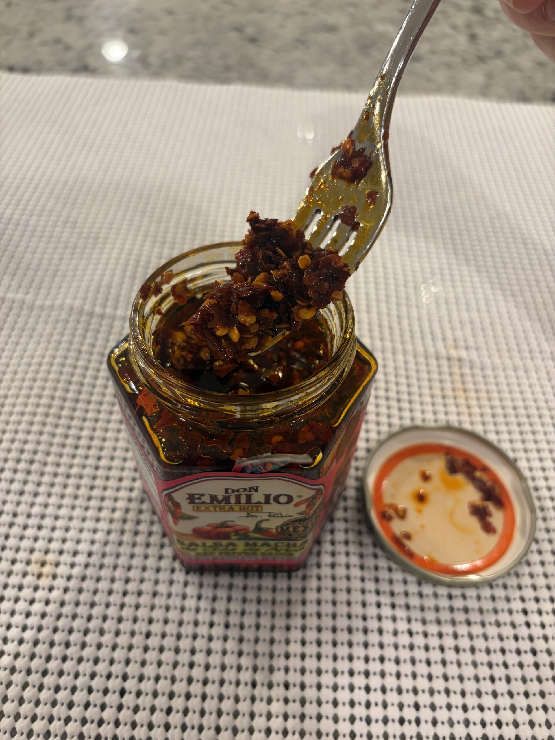Don Emilio salsa macha fork pull showing oil and chili bits — Flavor Index Lab