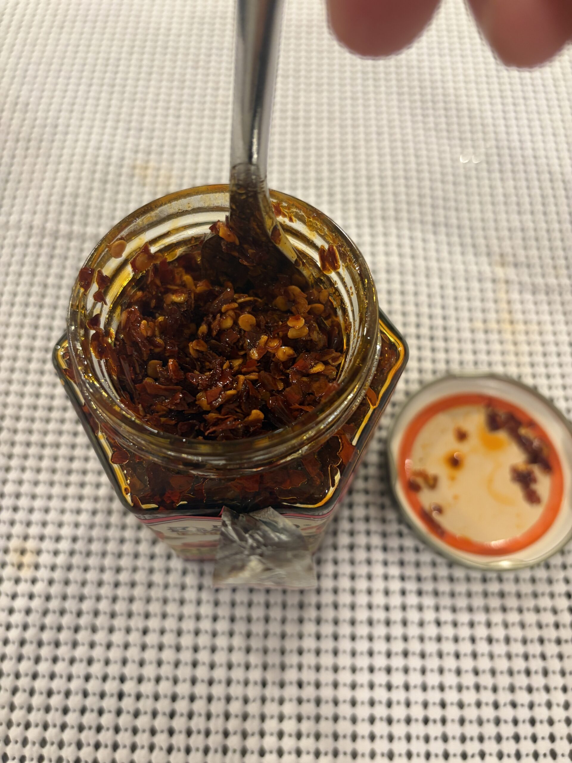 Don Emilio salsa macha post-stir texture showing seeds and chili — Flavor Index Lab