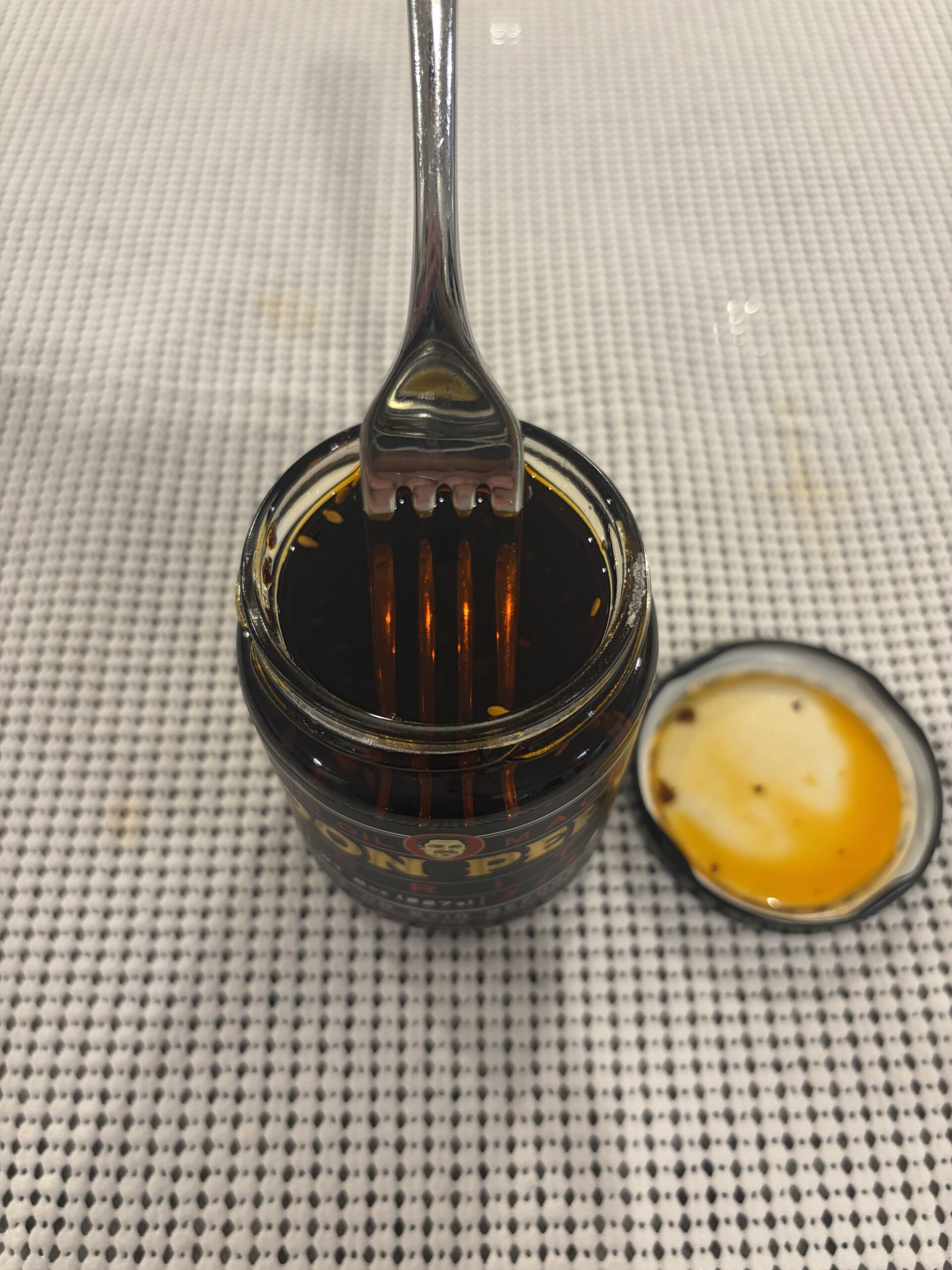 Fork resting on Don Pepe salsa macha solids without sinking — Flavor Index Lab