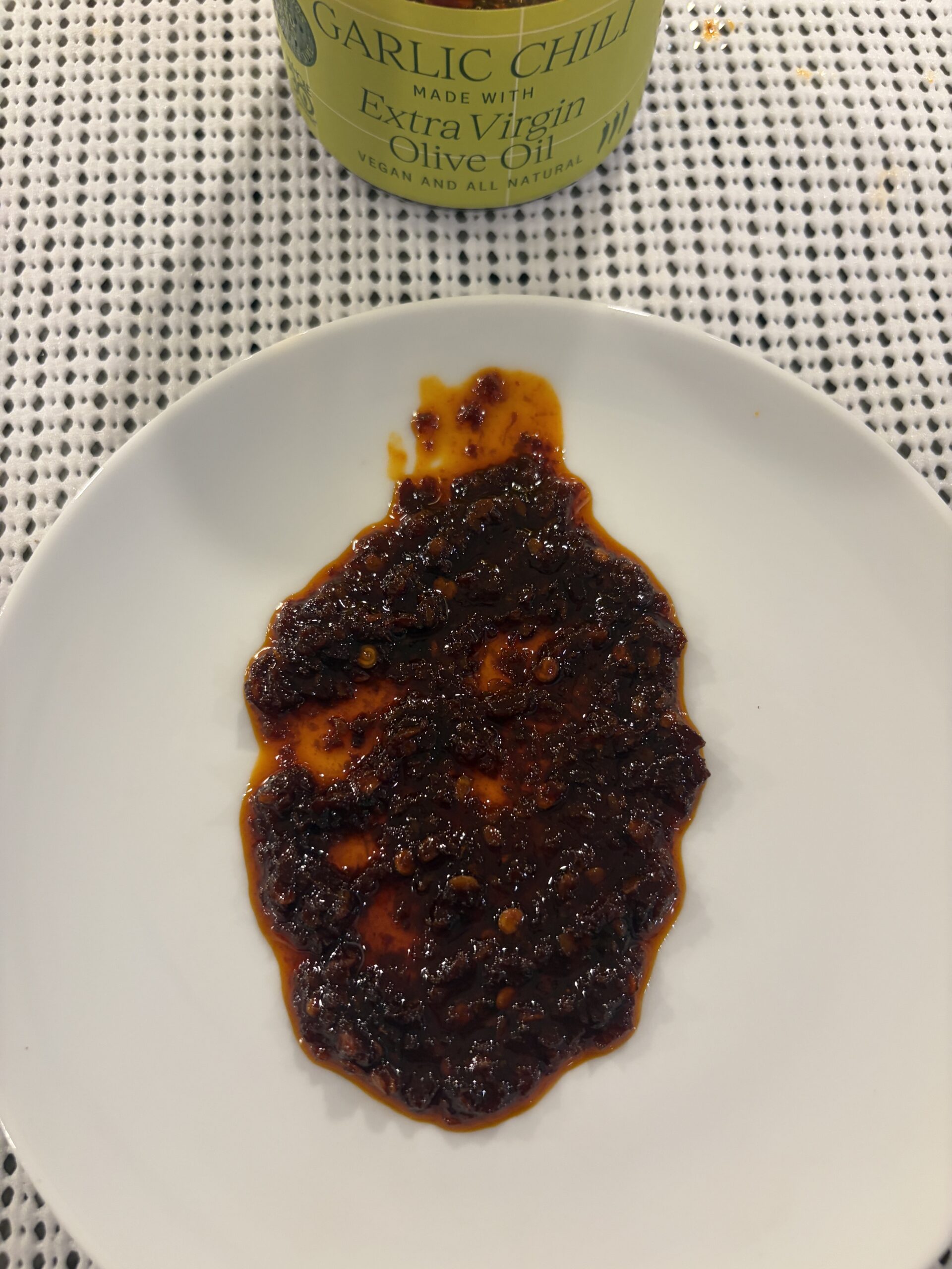 Everiday garlic chili oil spread on white plate — Flavor Index Lab