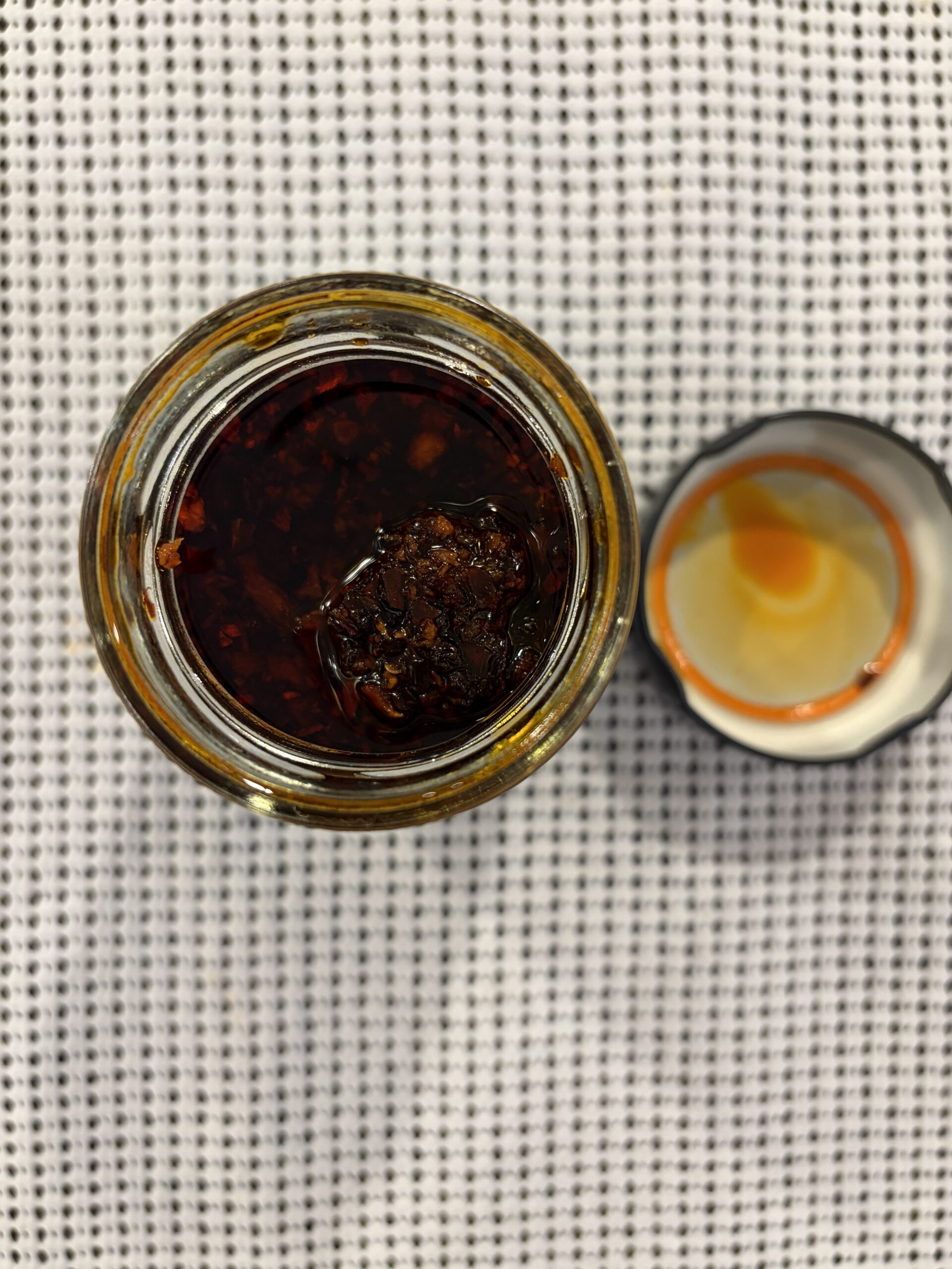 Fly By Jing Mild chili crisp open jar top-down view — Flavor Index Lab