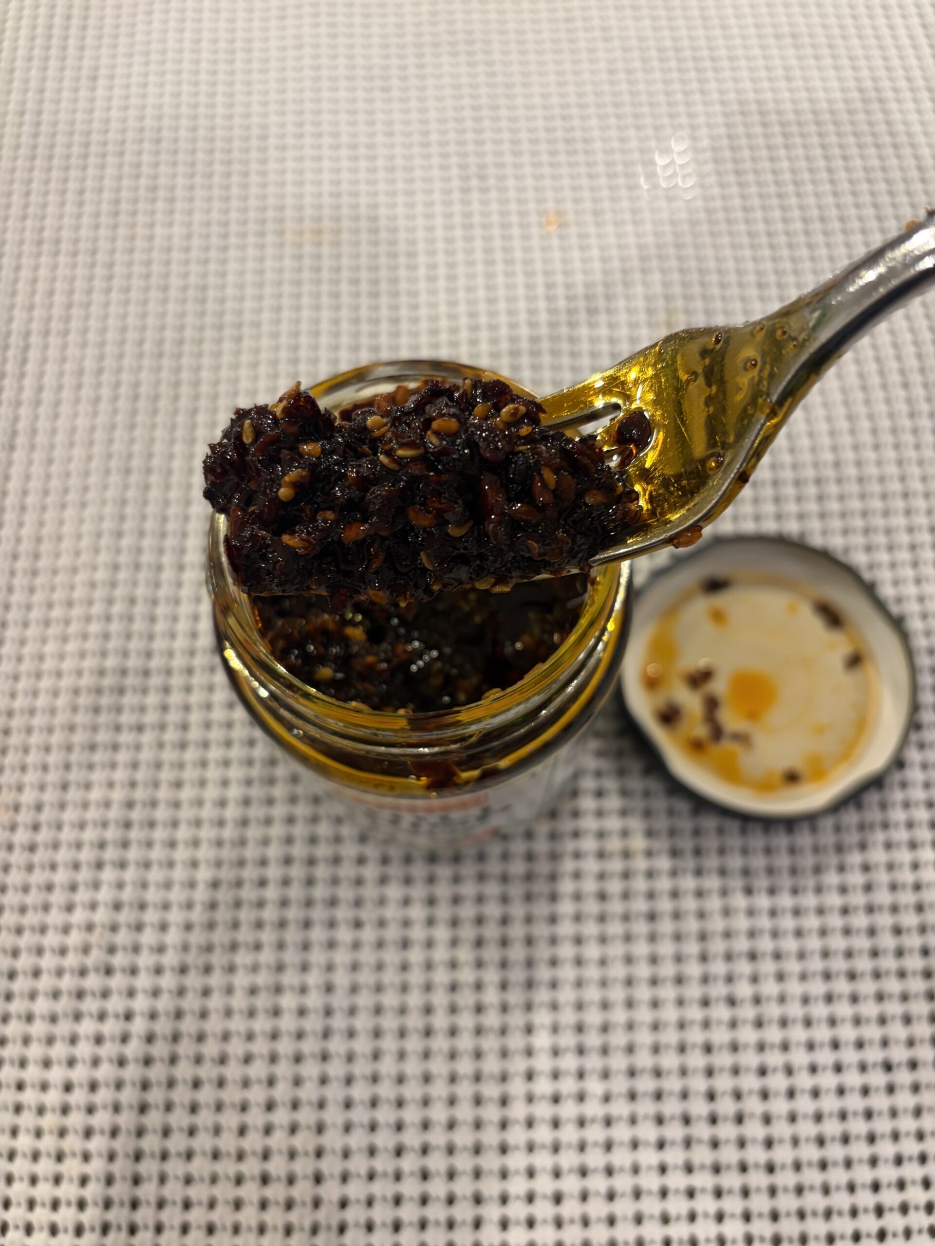 Lee Kum Kee cilantro chili crisp fork pull showing dense solids — Flavor Index Lab