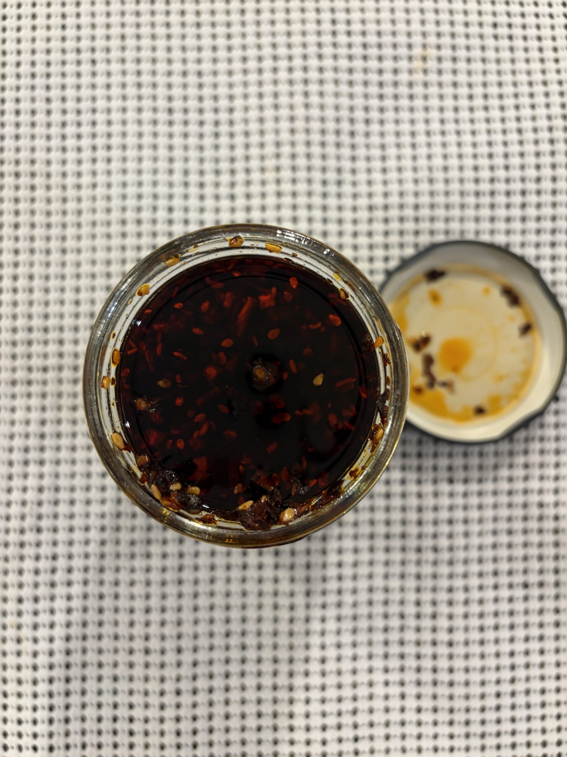 Lee Kum Kee cilantro chili crisp open jar top-down — Flavor Index Lab