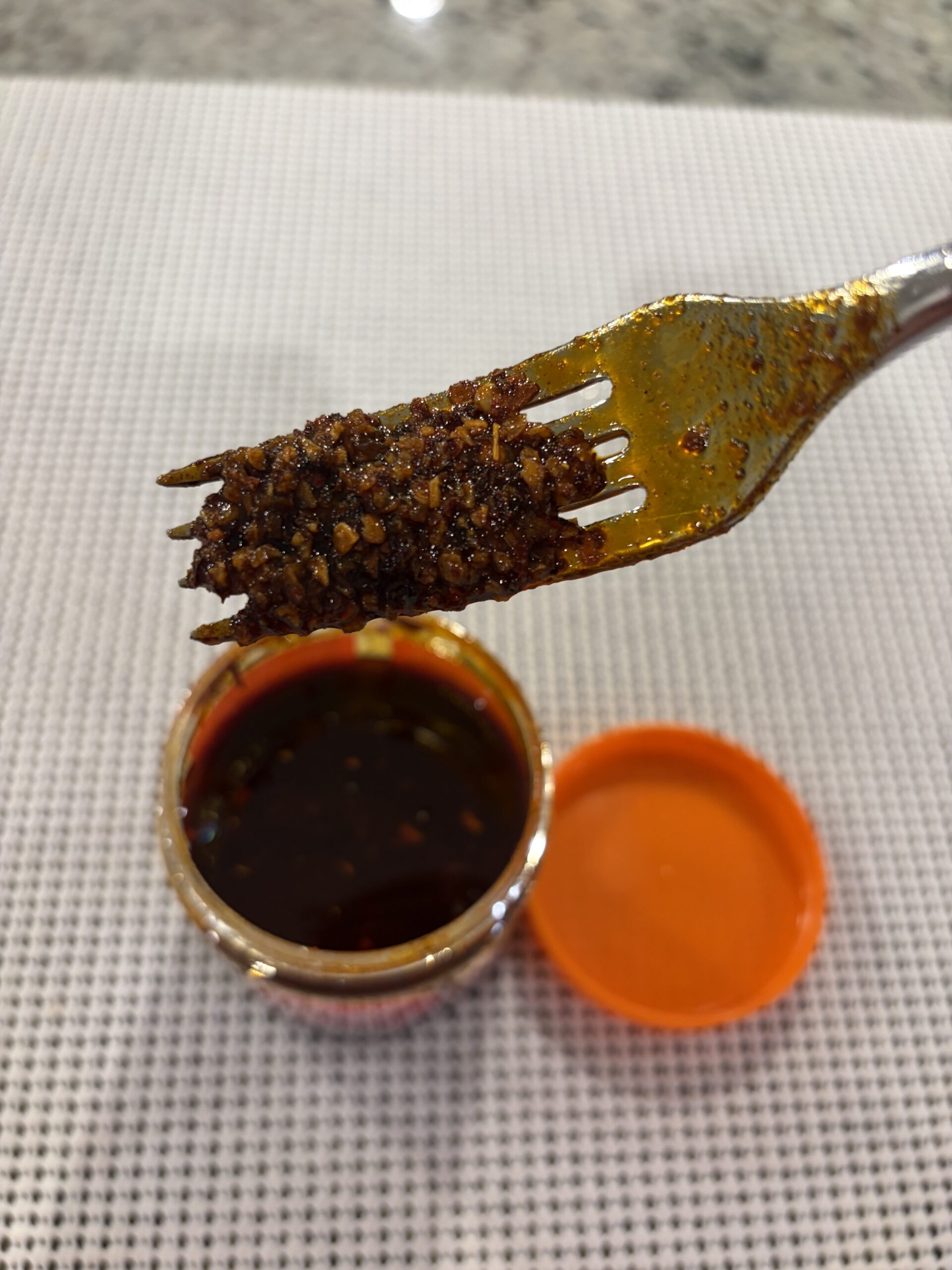 Mr. Bing mild chili crisp review fork pull showing texture — Flavor Index Lab