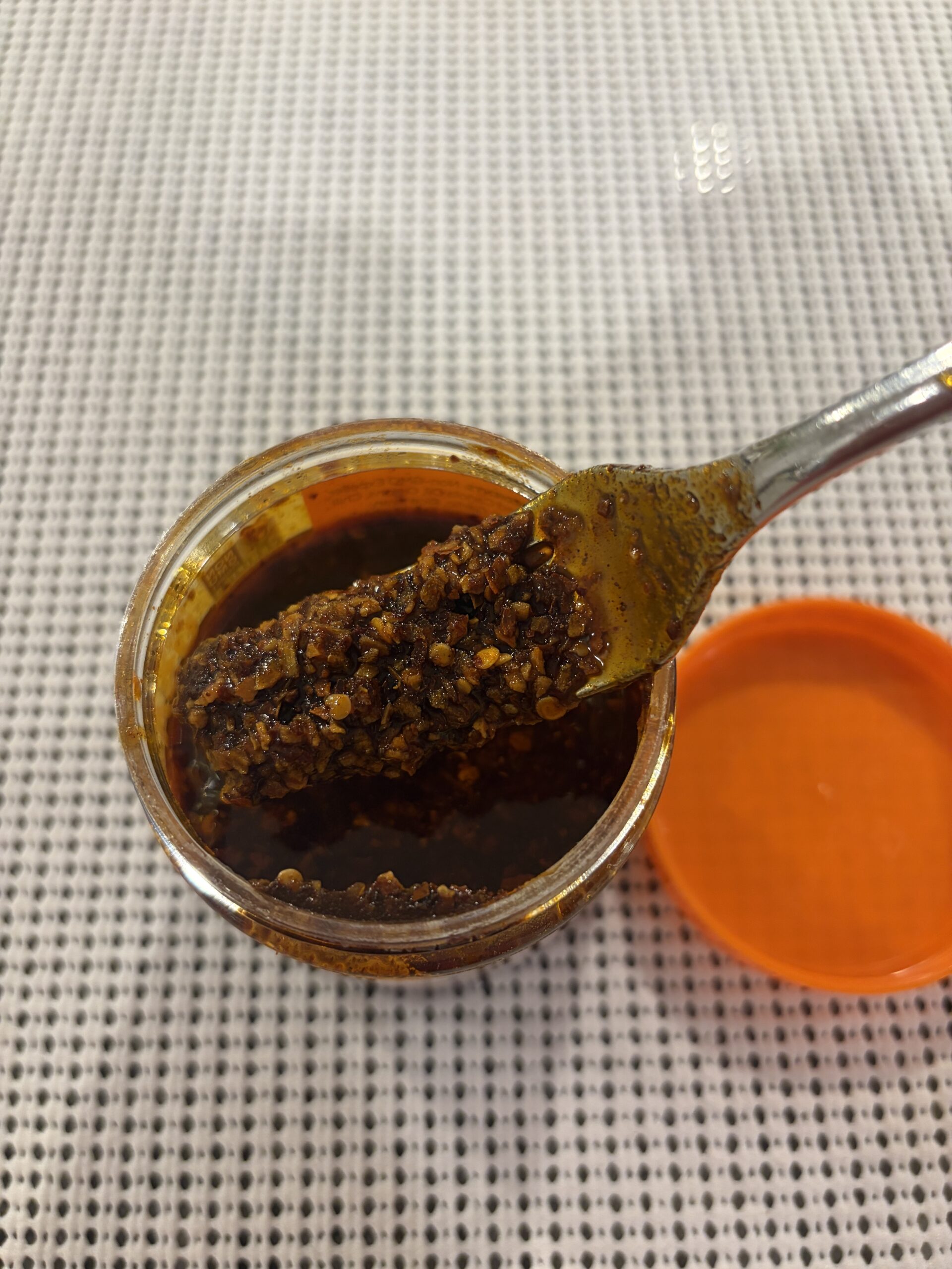 Mr. Bing spicy chili crisp fork pull close-up — Flavor Index Lab