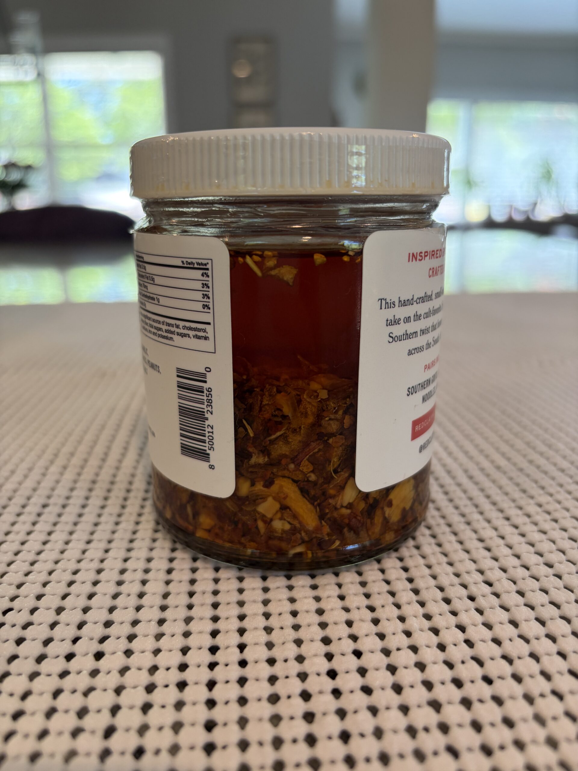 Red Clay Southern Chili Crisp oil and settlement in jar — Flavor Index Lab