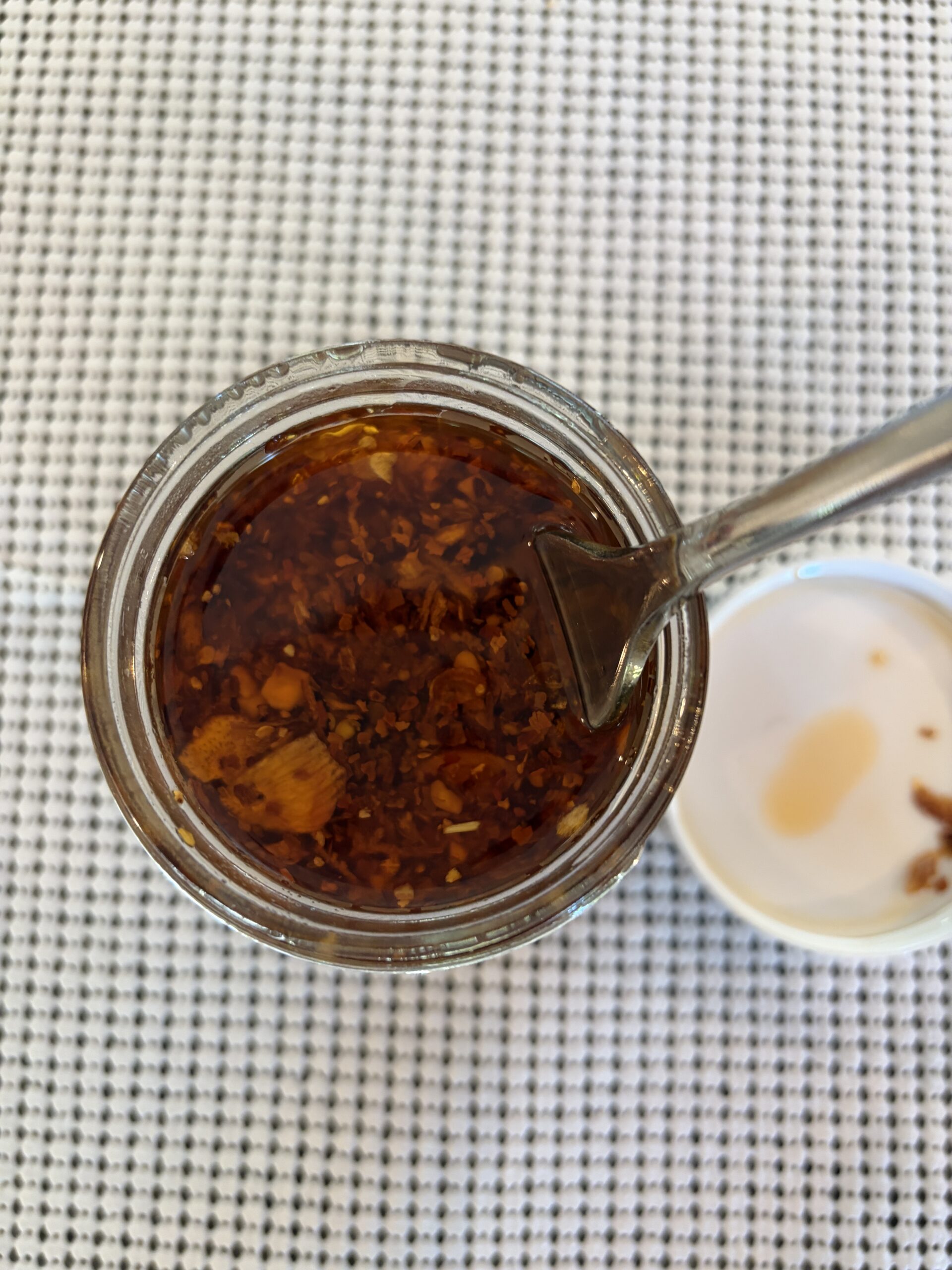 Red Clay Southern Chili Crisp stirred showing garlic shallot and peanut chunks — Flavor Index Lab