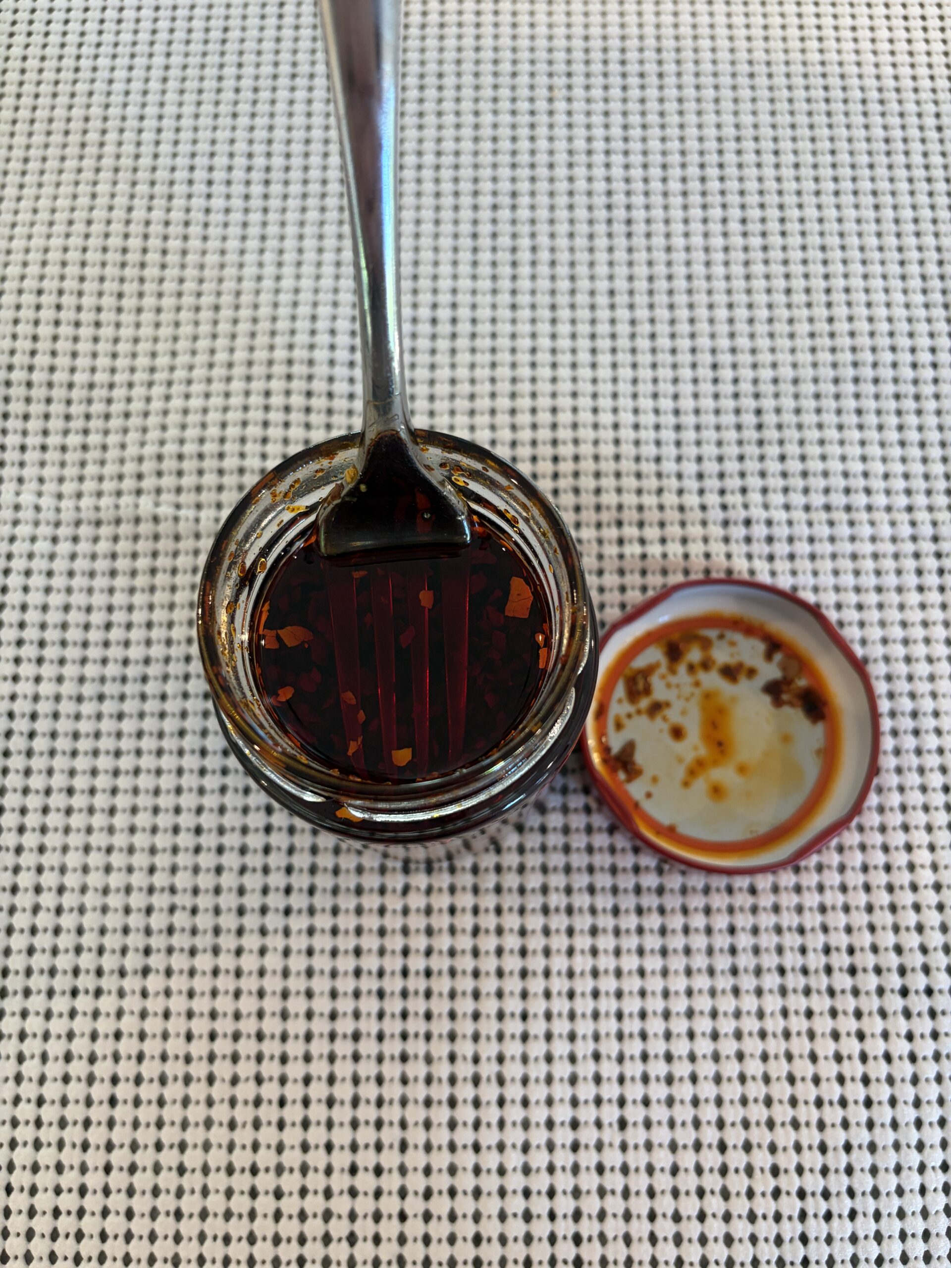 Fork resting on Redbloom Aroma chili crisp solids — Flavor Index Lab