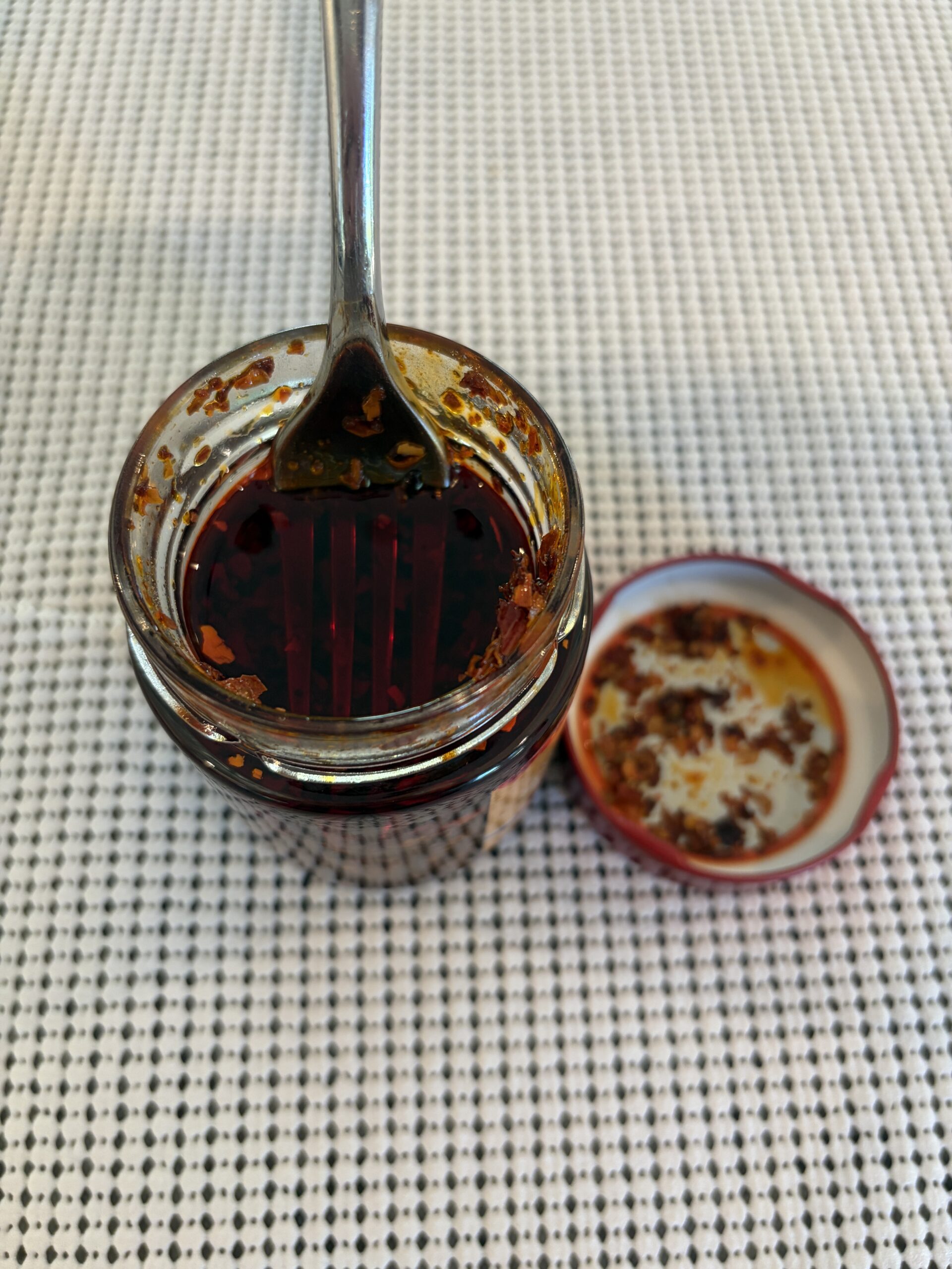 Fork resting on Redbloom Umami chili crisp solids — Flavor Index Lab