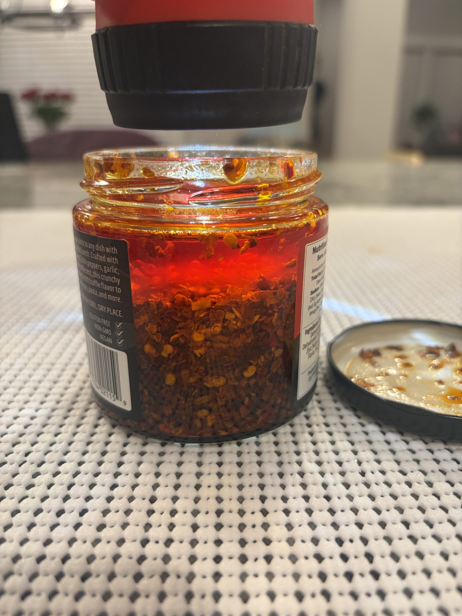 Sabatino Calabrian Truffle Crunch oil and chili flakes settled in jar — Flavor Index Lab